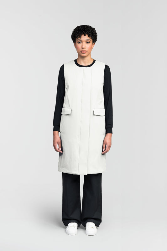 Brexton Women's Tailored Long Mid Layer Vest in knee length, centre front wind flap, flap closure waist pocket with additional side entry storage, single vent on back bottom hem, in Chalk + Chalk