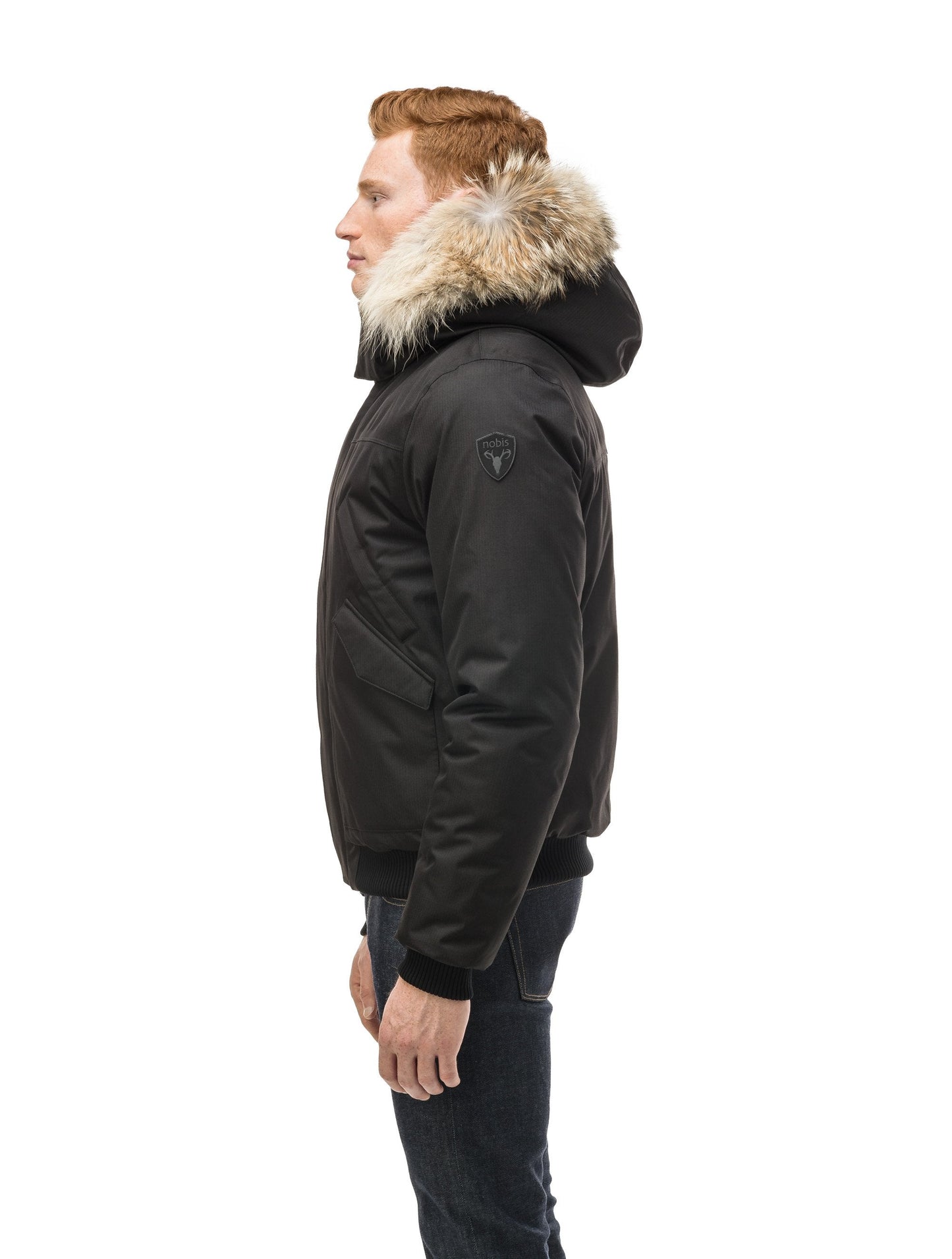 Men's classic down filled bomber jacket with a down filled hood that features a removable coyote fur trim and concealed moldable framing wire in Black