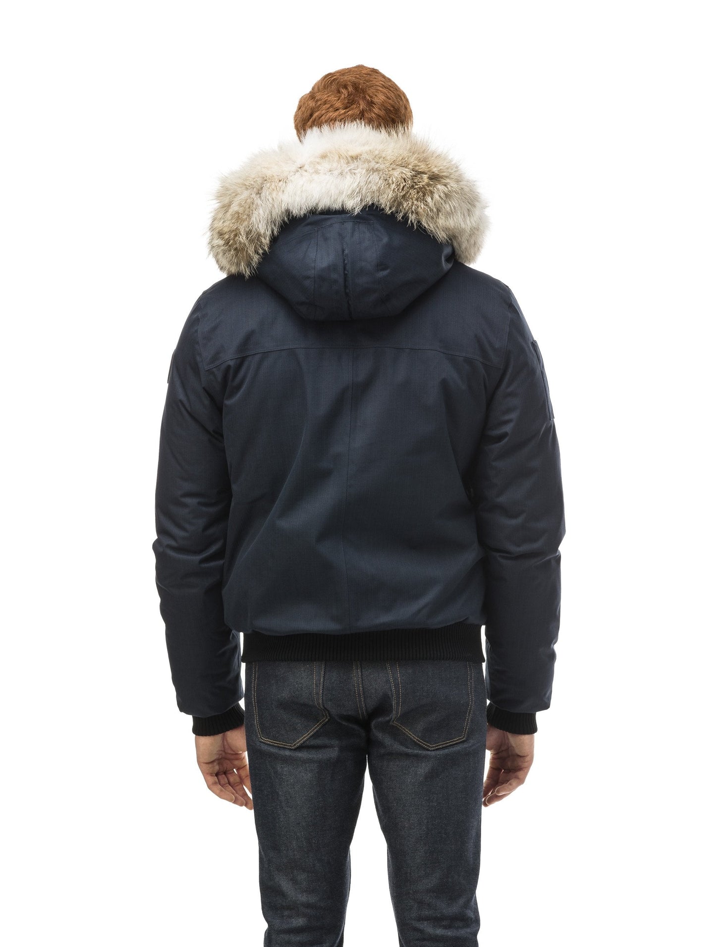 Men's classic down filled bomber jacket with a down filled hood that features a removable coyote fur trim and concealed moldable framing wire in Navy