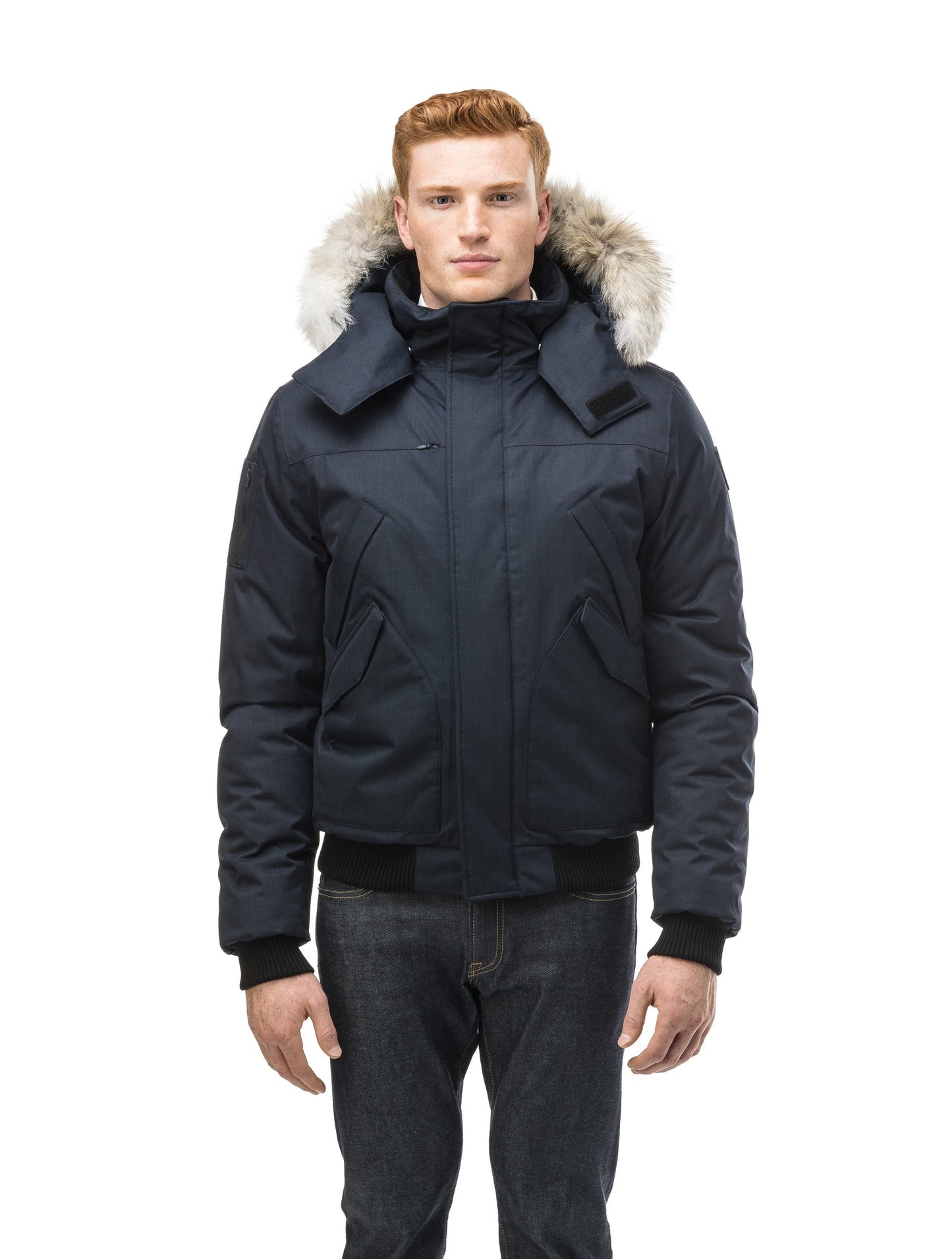 Men's classic down filled bomber jacket with a down filled hood that features a removable coyote fur trim and concealed moldable framing wire in Navy