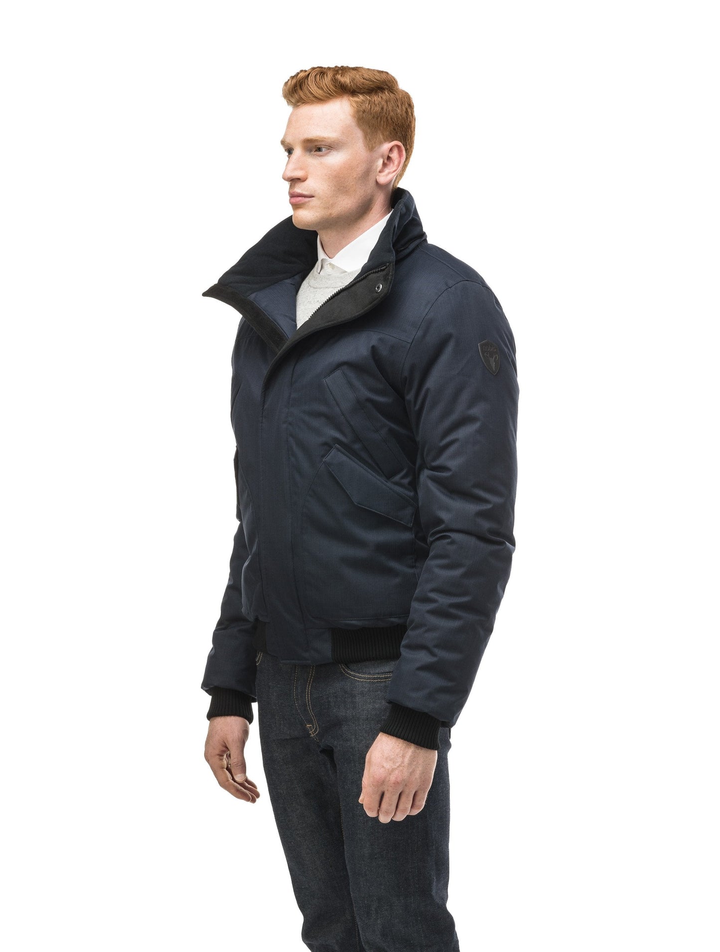 Men's classic down filled bomber jacket with a down filled hood that features a removable coyote fur trim and concealed moldable framing wire in Navy
