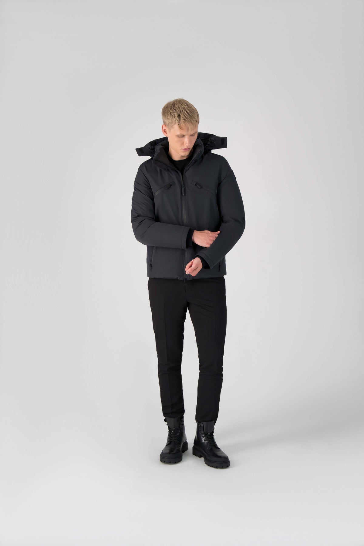 Hip length, reversible men's down filled jacket with removable hood in Black