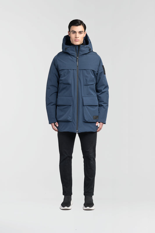 Ronin Men's Performance Utility Jacket in thigh length, premium 3-ply micro denier and stretch ripstop fabrication, Premium Canadian origin White Duck Down insulation, non-removable down-filled hood, bellow chest pockets, magnetic closure waist flap pockets, two-way centre-front zipper, pit zipper vents, hidden adjustable waist drawcord, in Marine + Marine