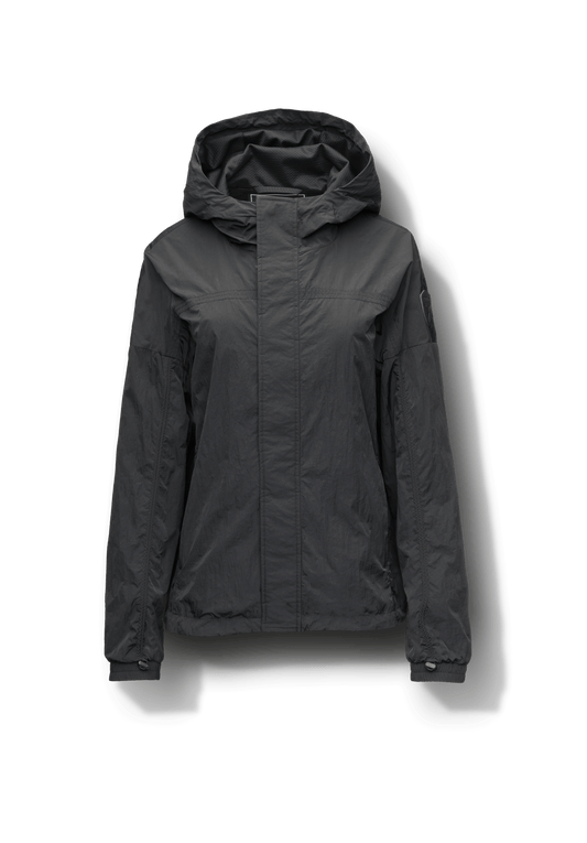 Hartley Women's Tailored Rain Jacket in hip length, two-way centre front zipper with wind flap, toggle adjustable cuffs and waist cord, non-removable hood, side entry waist pockets, in Black + Black
