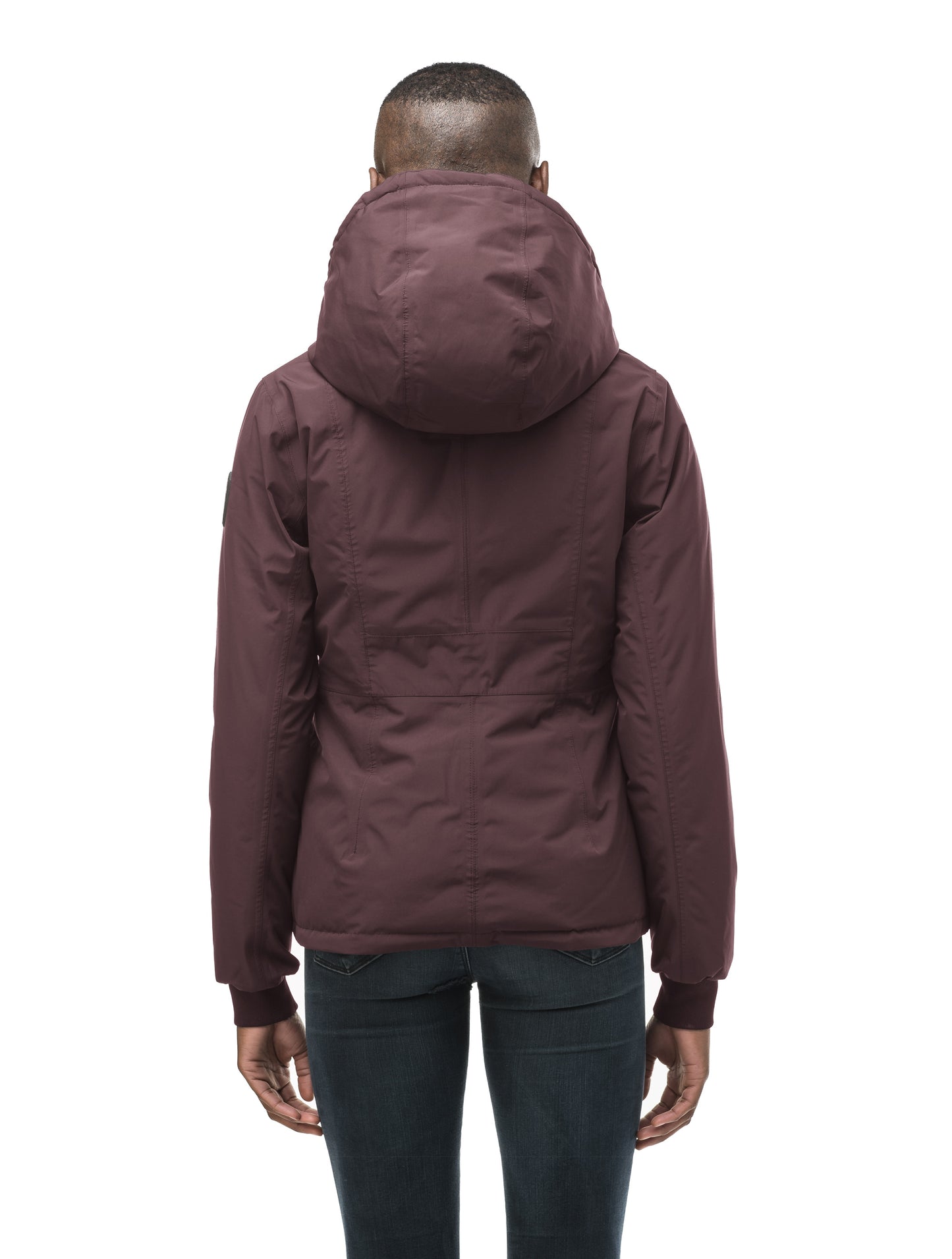 A women's two in one reversible hip length down jacket, one side is quilted and one side is solid waterproof fabric in Burgundy