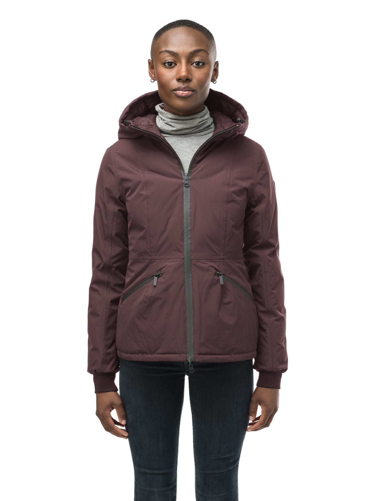 A women's two in one reversible hip length down jacket, one side is quilted and one side is solid waterproof fabric in Burgundy