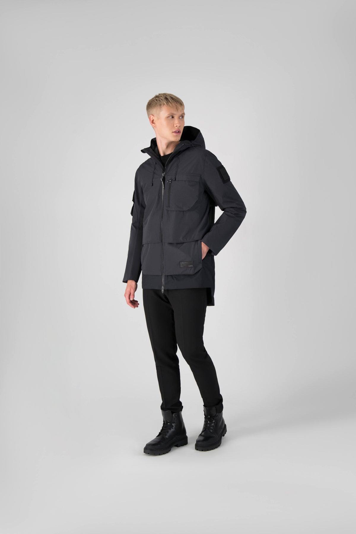 Alta Men's Performance Shell Jacket in hip length, Primaloft Gold Insulation Active+, chest and waist pockets, ventilation under arms, reflective detailing on hood and back, two-way front zipper, and non-removable hood with adjustable drawstrings, in Black