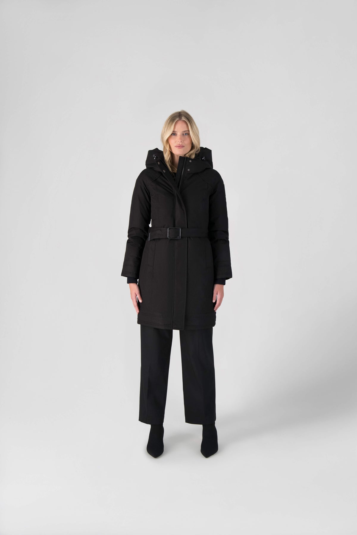 Women's Thigh length own parka with a furless oversized hood in Black