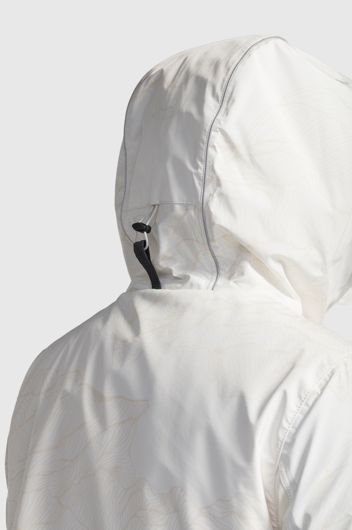 Alta Men's Performance Shell Jacket in hip length, Primaloft Gold Insulation Active+, chest and waist pockets, ventilation under arms, reflective detailing on hood and back, two-way front zipper, and non-removable hood with adjustable drawstrings, in Wheat Desert