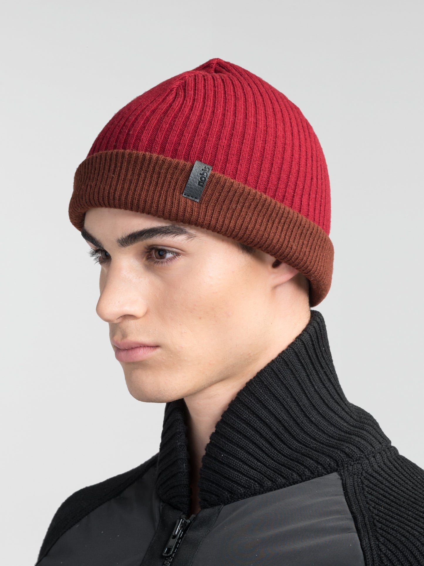 Ardn Unisex Tailored Reversible Knit Beanie in an extra fine merino wool blend, fitted rib knit, and reversible design, in Potent Purple/Rio Red