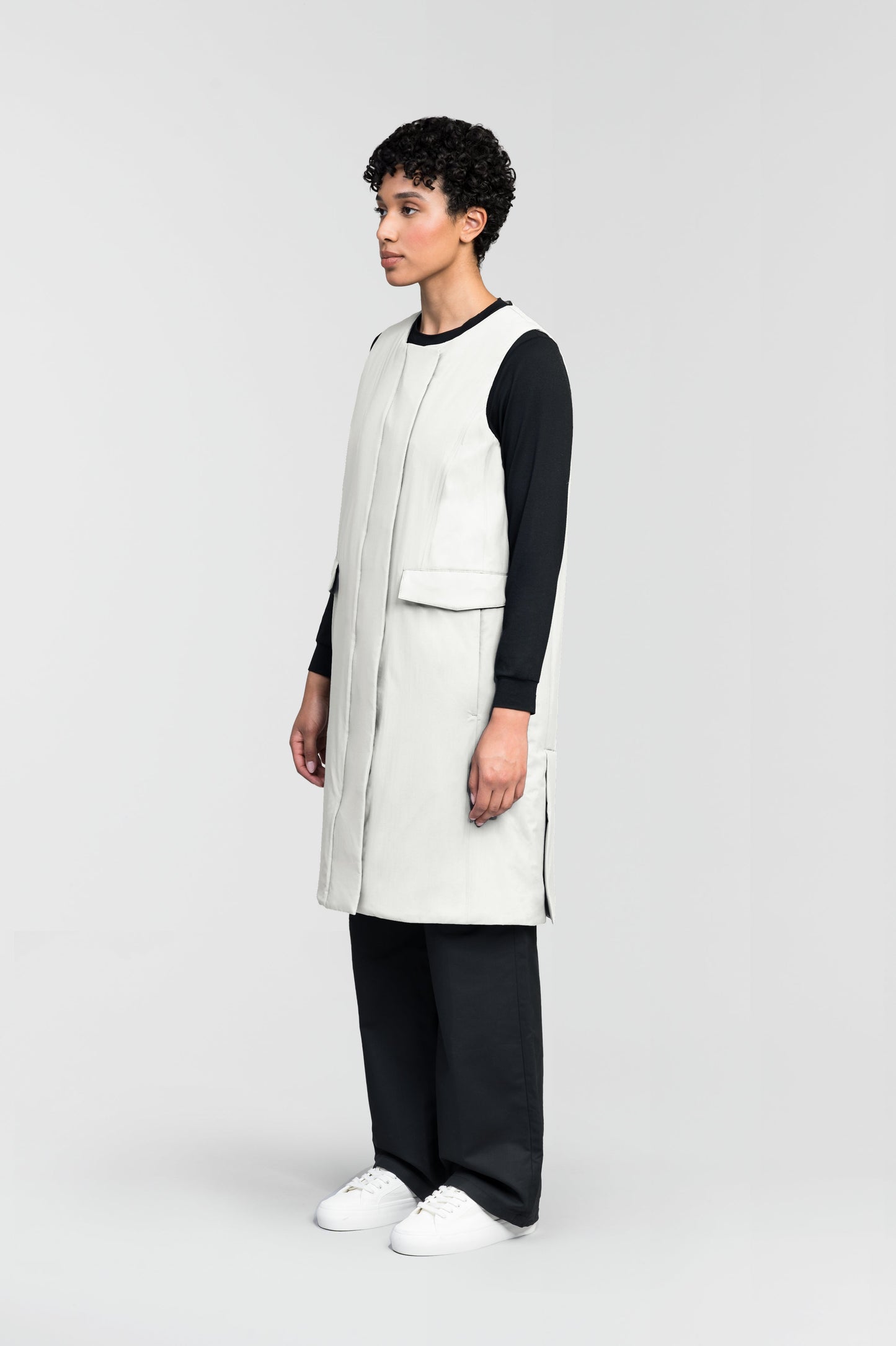 Brexton Women's Tailored Long Mid Layer Vest in knee length, centre front wind flap, flap closure waist pocket with additional side entry storage, single vent on back bottom hem, in Chalk