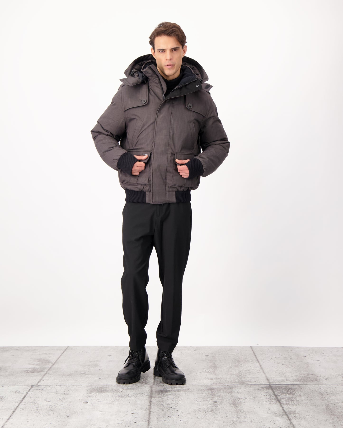 Men's down filled bomber that sits just above the hips with a completely removable hood that's windproof, waterproof, and breathable in CH Steel Grey