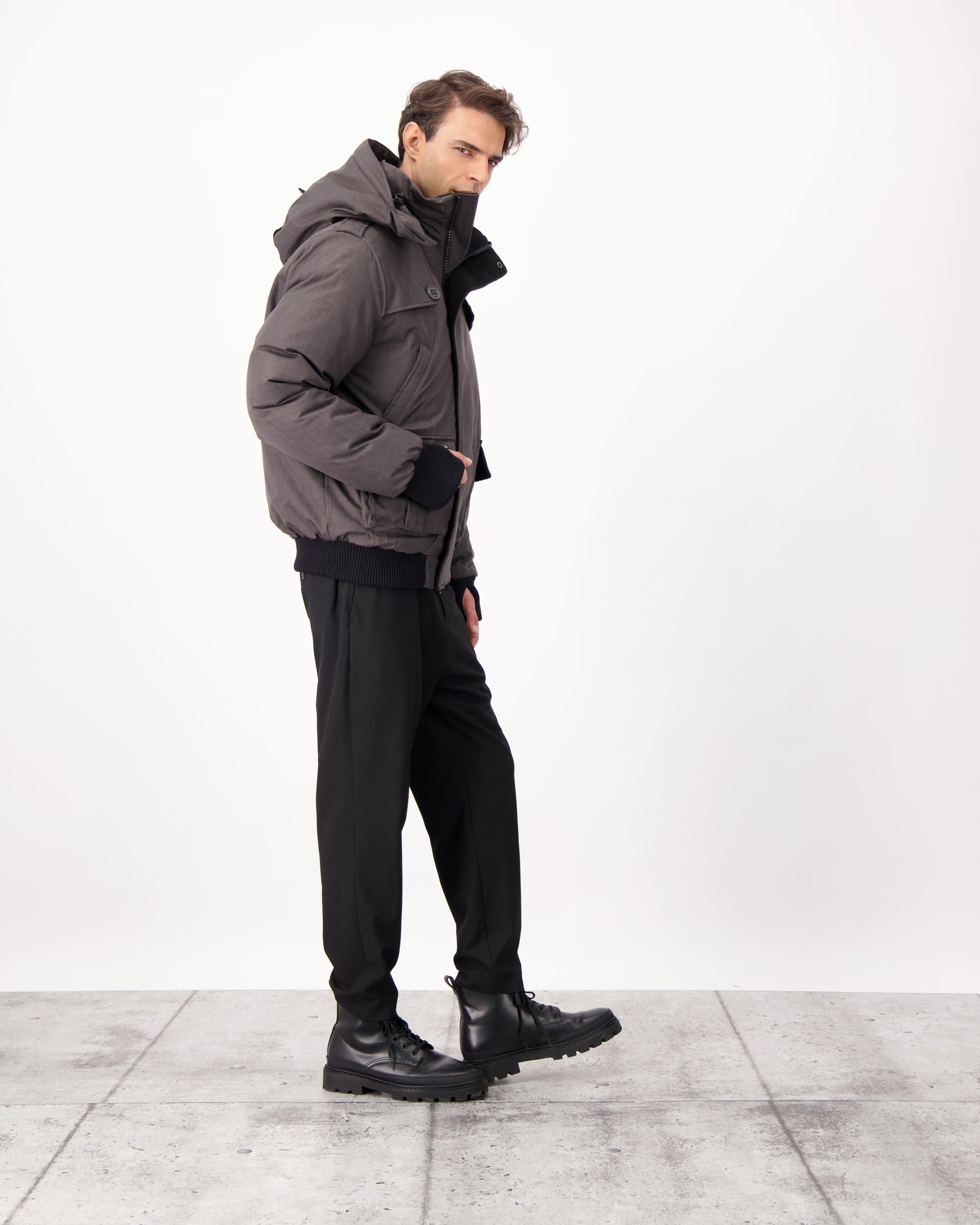 Men's down filled bomber that sits just above the hips with a completely removable hood that's windproof, waterproof, and breathable in CH Steel Grey