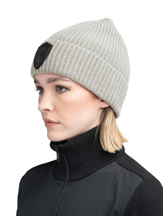 Emer Unisex Tailored Chunky Knit Beanie in extra fine merino wool blend, and black leather Nobis shield logo on cuff, in Wheat