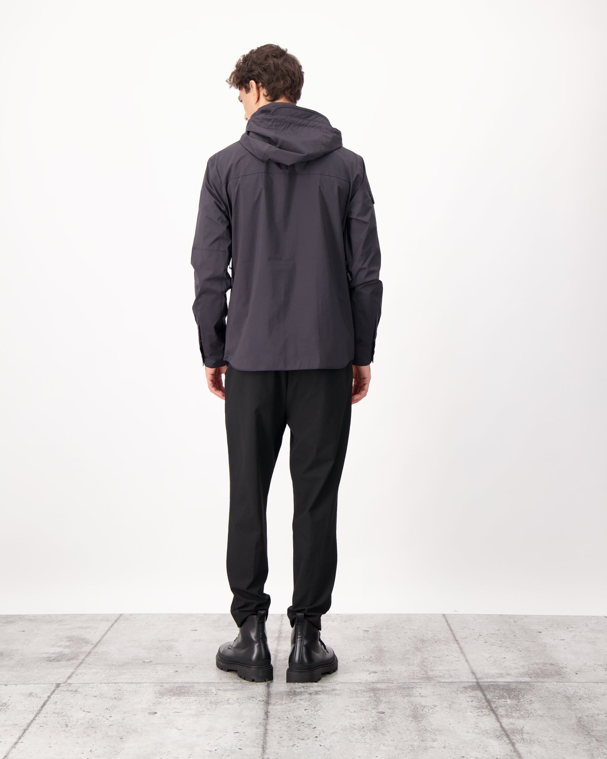 Fisherman is a men’s lightweight waterproof jacket offering exceptional durability, crafted from matte technical taffeta with a breathable, seam-sealed construction for dependable weather protection in Black