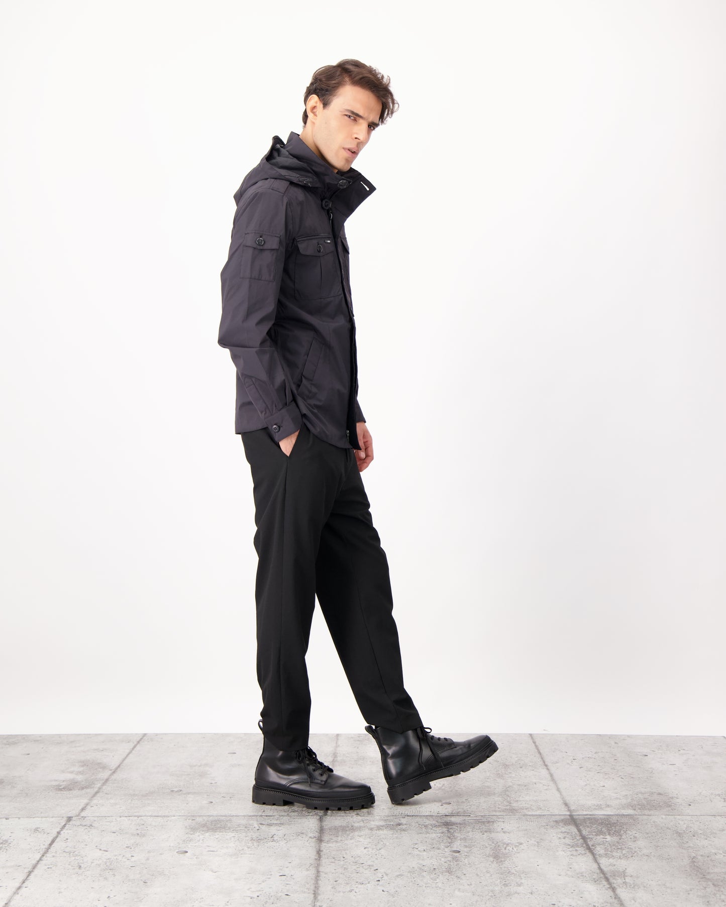 Fisherman is a men’s lightweight waterproof jacket offering exceptional durability, crafted from matte technical taffeta with a breathable, seam-sealed construction for dependable weather protection in Black