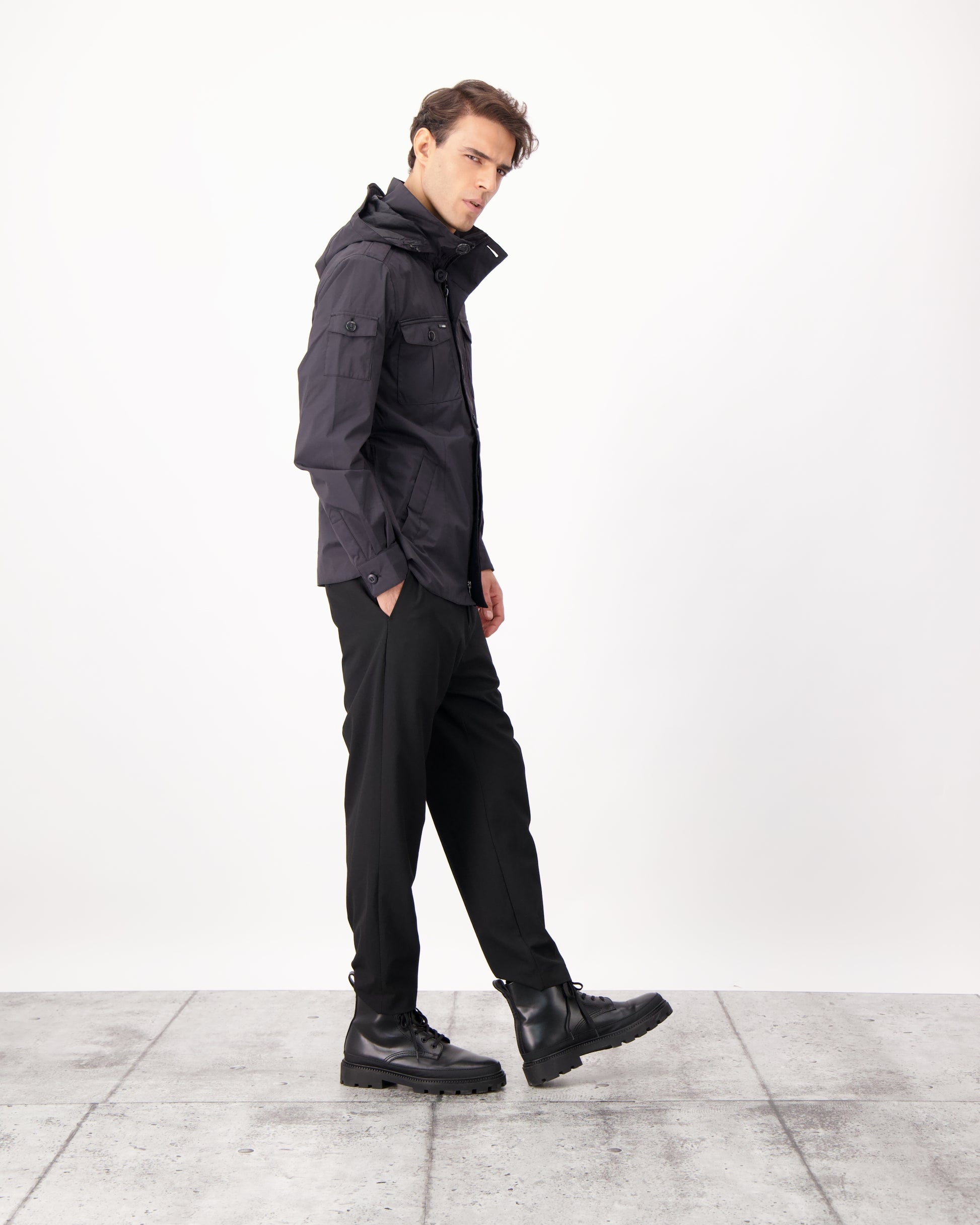 Fisherman is a men’s lightweight waterproof jacket offering exceptional durability, crafted from matte technical taffeta with a breathable, seam-sealed construction for dependable weather protection in Black
