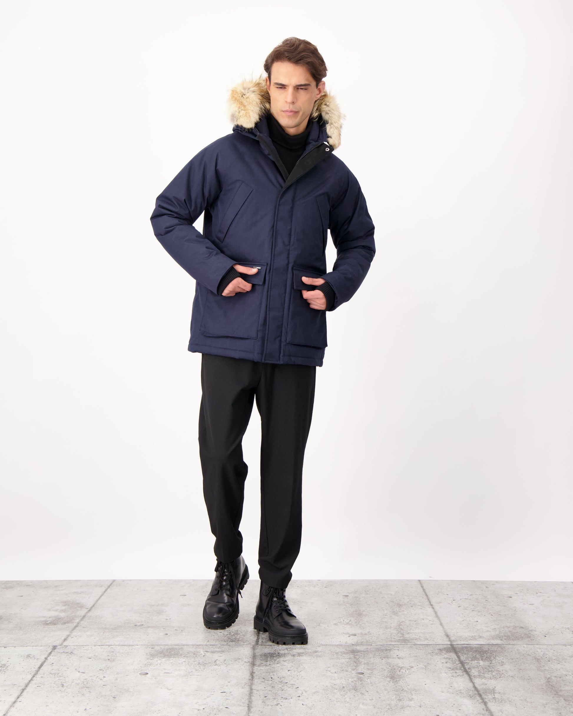 Men's waist length down filled jacket with two front pockets with magnetic closure and a removable fur trim on the hood in CH Navy