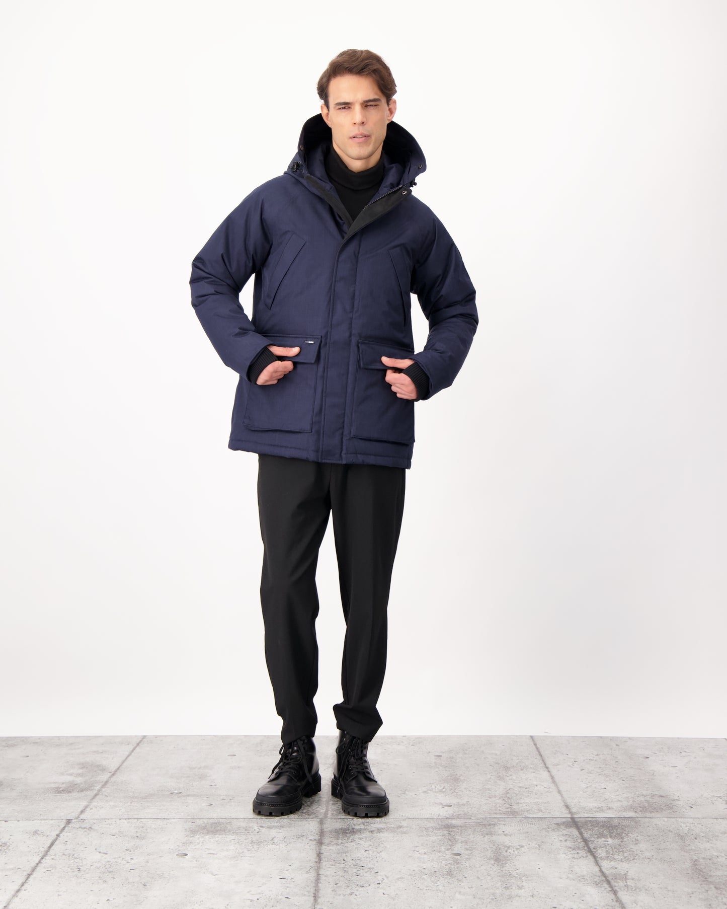 Men's waist length down filled jacket with two front pockets with magnetic closure and a removable fur trim on the hood in CH Navy