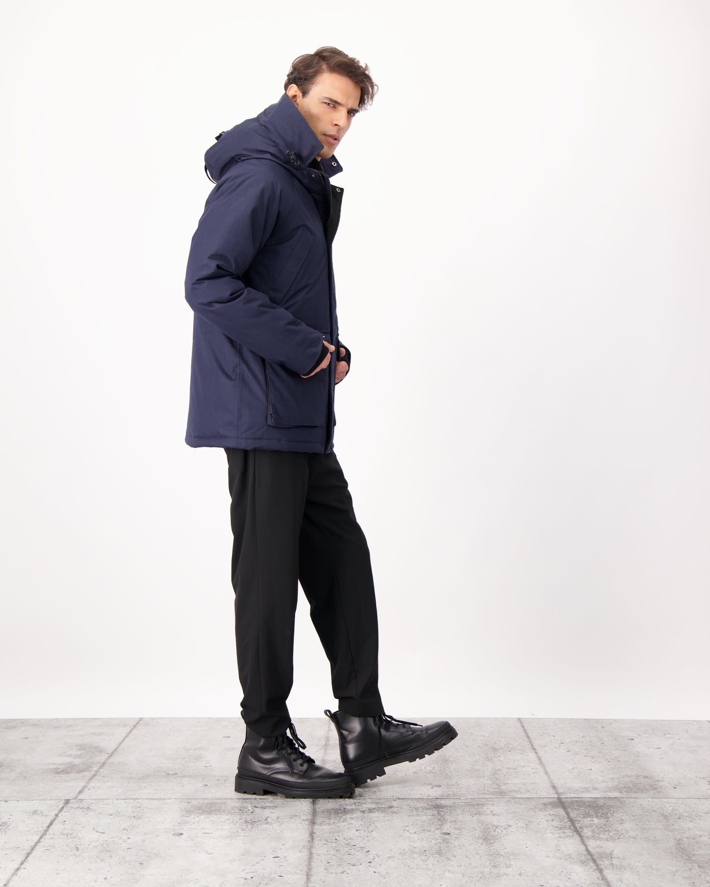 Men's waist length down filled jacket with two front pockets with magnetic closure and a removable fur trim on the hood in CH Navy