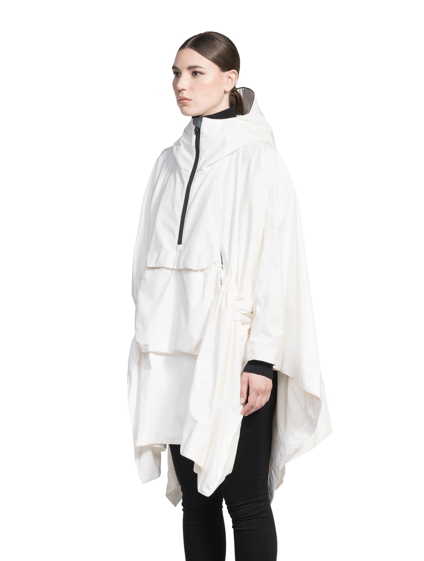Hydra Unisex Performance Poncho in thigh length, non-removable hood, vertical half-zipper along centre front collar, hidden side-entry waist zipper pockets, adjustable webbing straps and snap closure cuffs, and packable to front kangaroo pocket with flap opening, in Chalk