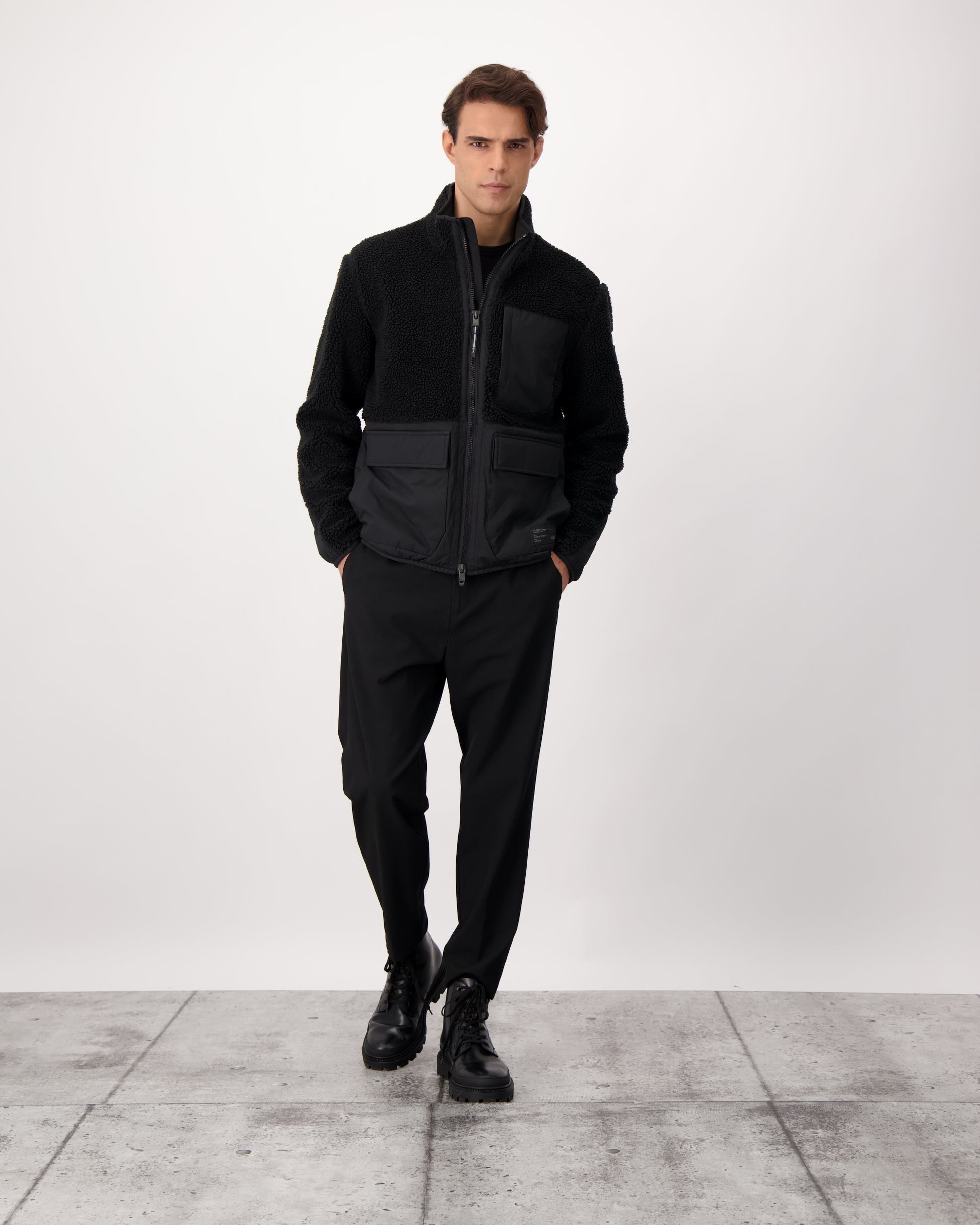 Kepler Men's Berber Zip Front Sweater in hip length, premium berber and stretch ripstop fabrication, Primaloft Gold Insulation Active+, two-way centre-front zipper, zipper pocket at left chest, magnetic closure flap pockets at waist with additional side-entry pockets, in Black