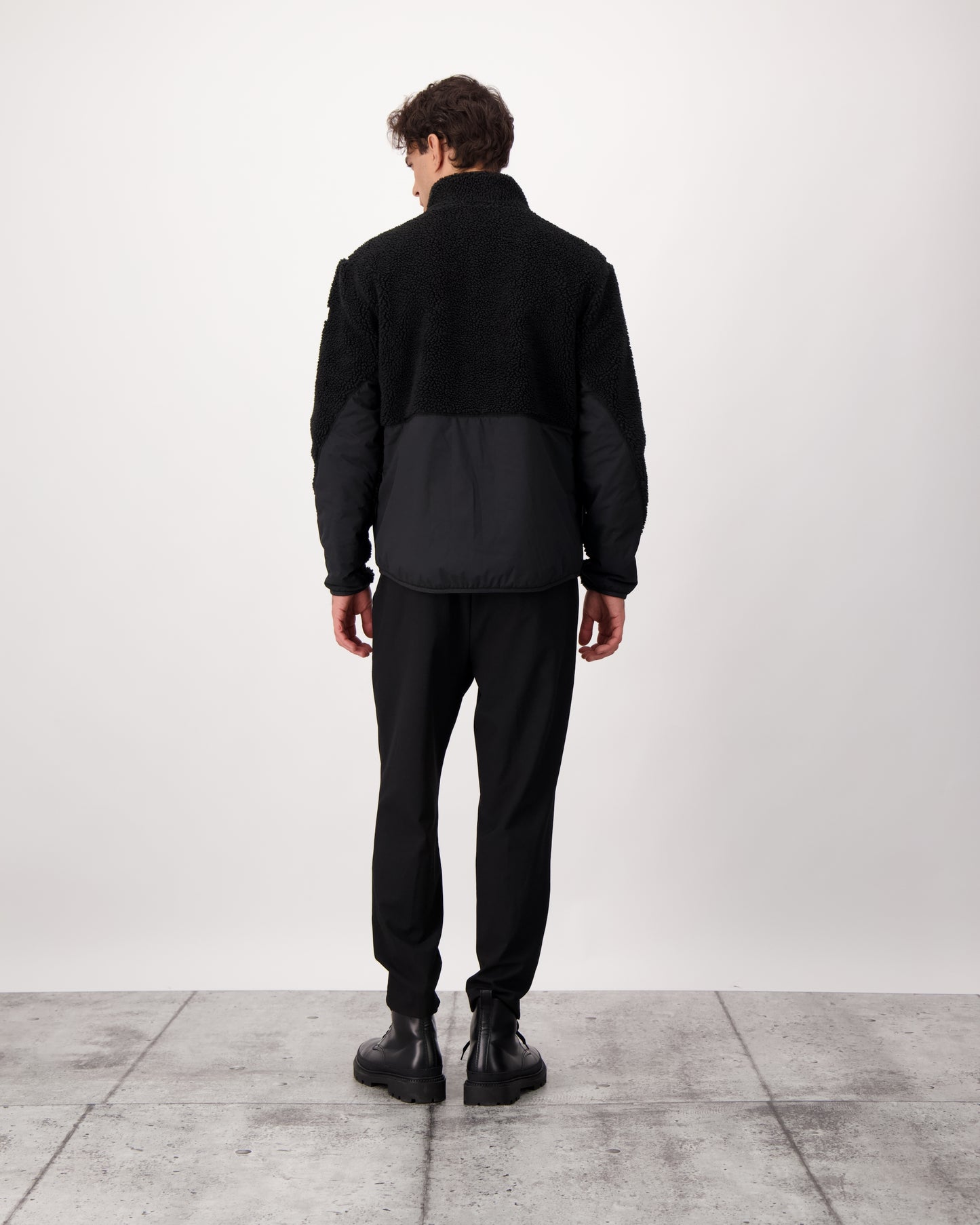 Kepler Men's Berber Zip Front Sweater in hip length, premium berber and stretch ripstop fabrication, Primaloft Gold Insulation Active+, two-way centre-front zipper, zipper pocket at left chest, magnetic closure flap pockets at waist with additional side-entry pockets, in Black