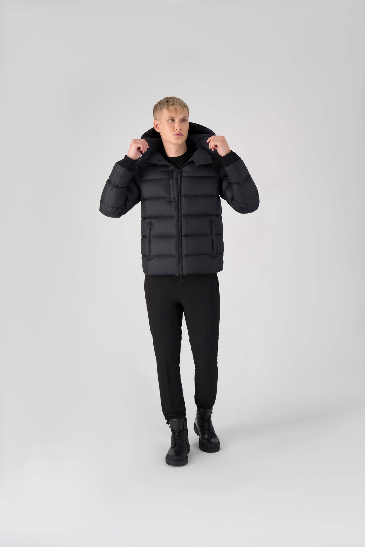 Hip length, reversible men's down filled jacket with removable hood in Black