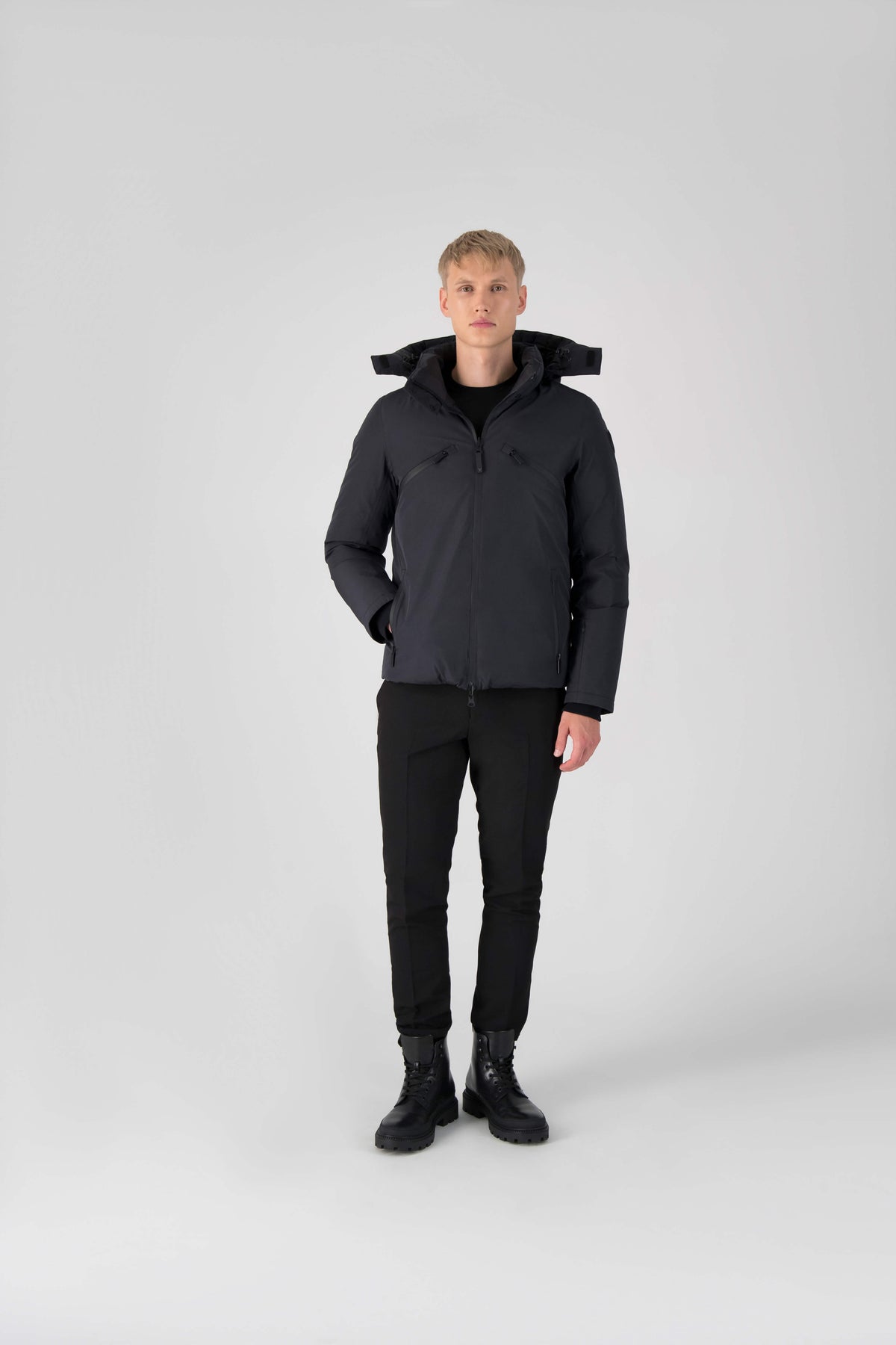 Hip length, reversible men's down filled jacket with removable hood in Black