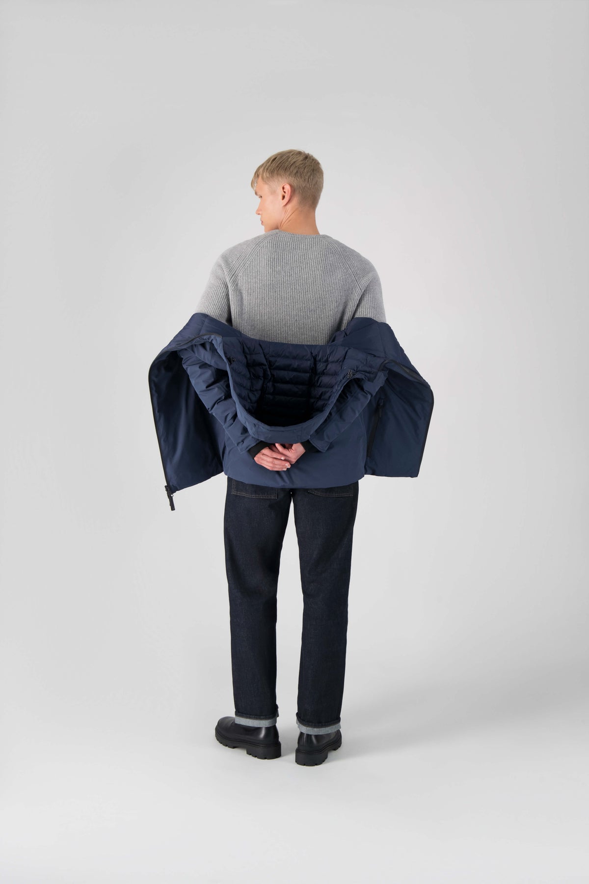 Hip length, reversible men's down filled jacket with removable hood in Marine
