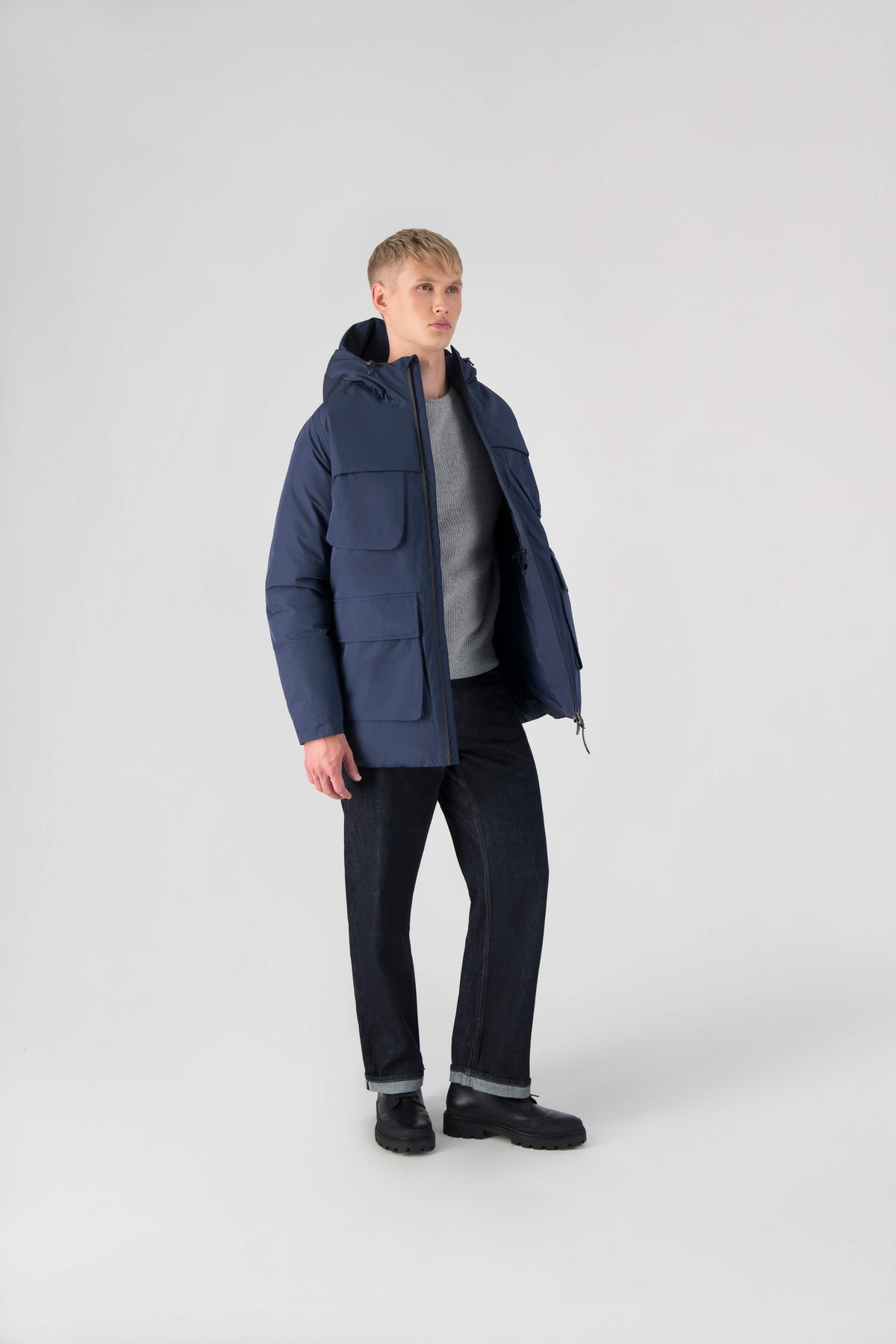 Ronin Men's Performance Utility Jacket in thigh length, premium 3-ply micro denier and stretch ripstop fabrication, Premium Canadian origin White Duck Down insulation, non-removable down-filled hood, bellow chest pockets, magnetic closure waist flap pockets, two-way centre-front zipper, pit zipper vents, hidden adjustable waist drawcord, in Marine