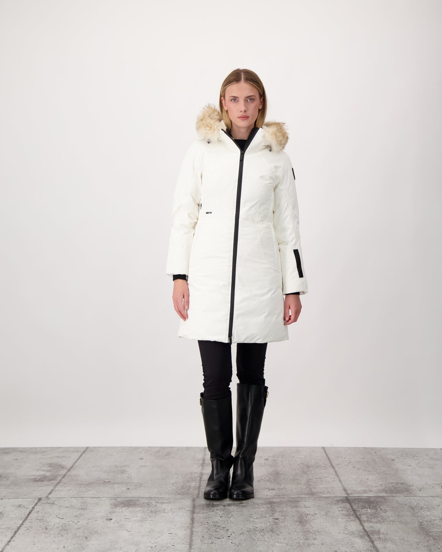 Ladies thigh length down-filled parka with non-removable hood and removable coyote fur trim in Chalk