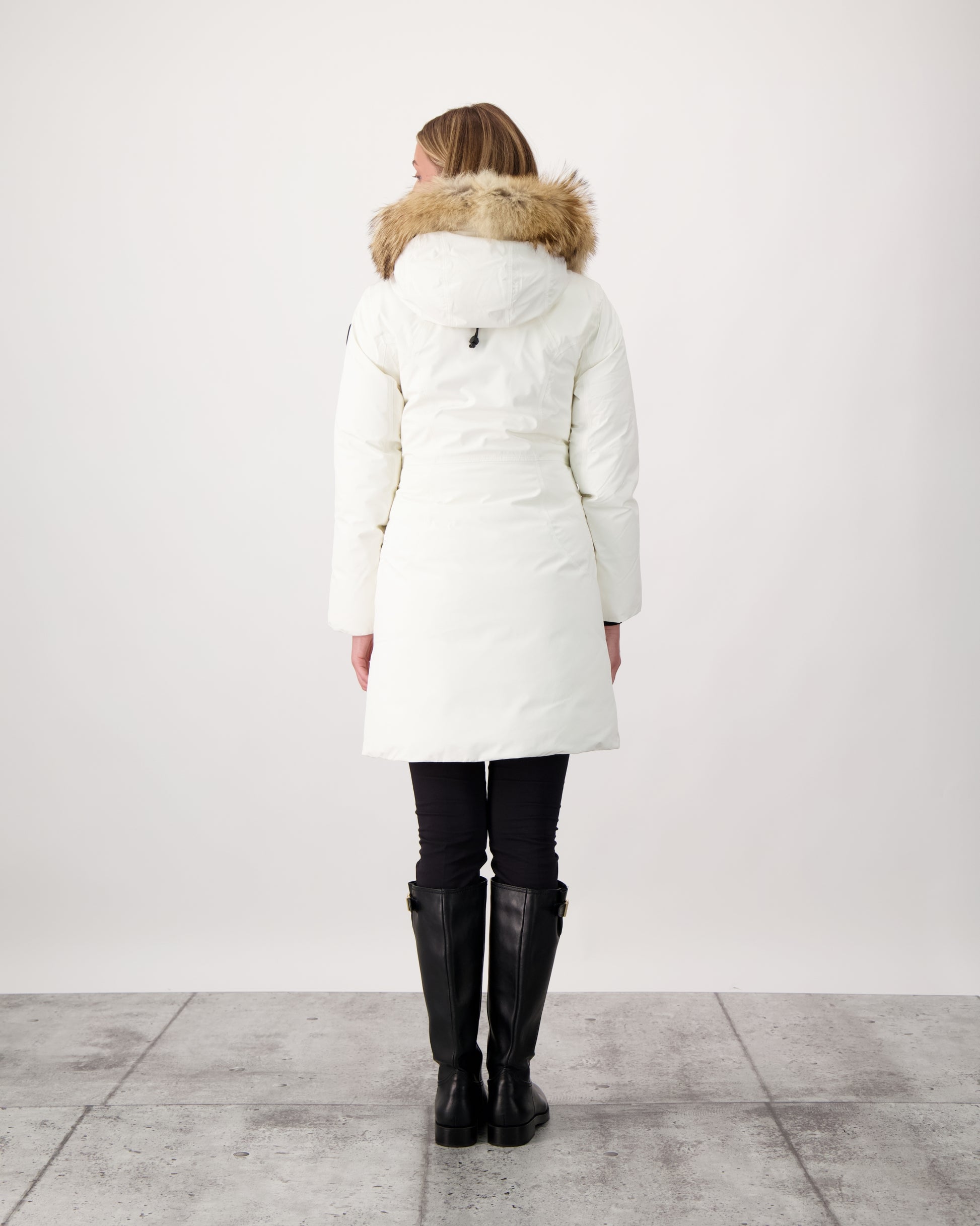 Ladies thigh length down-filled parka with non-removable hood and removable coyote fur trim in Chalk