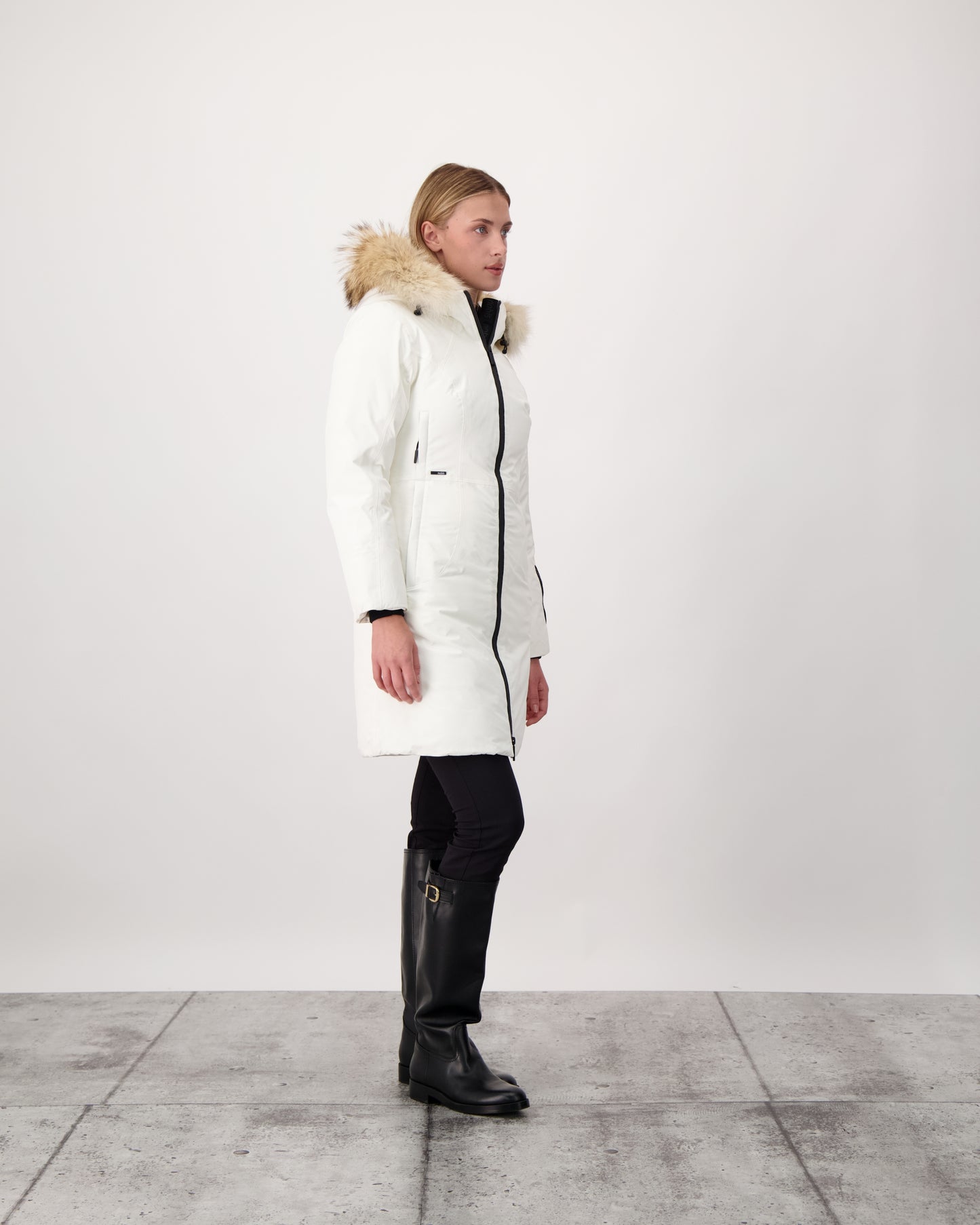 Ladies thigh length down-filled parka with non-removable hood and removable coyote fur trim in Chalk
