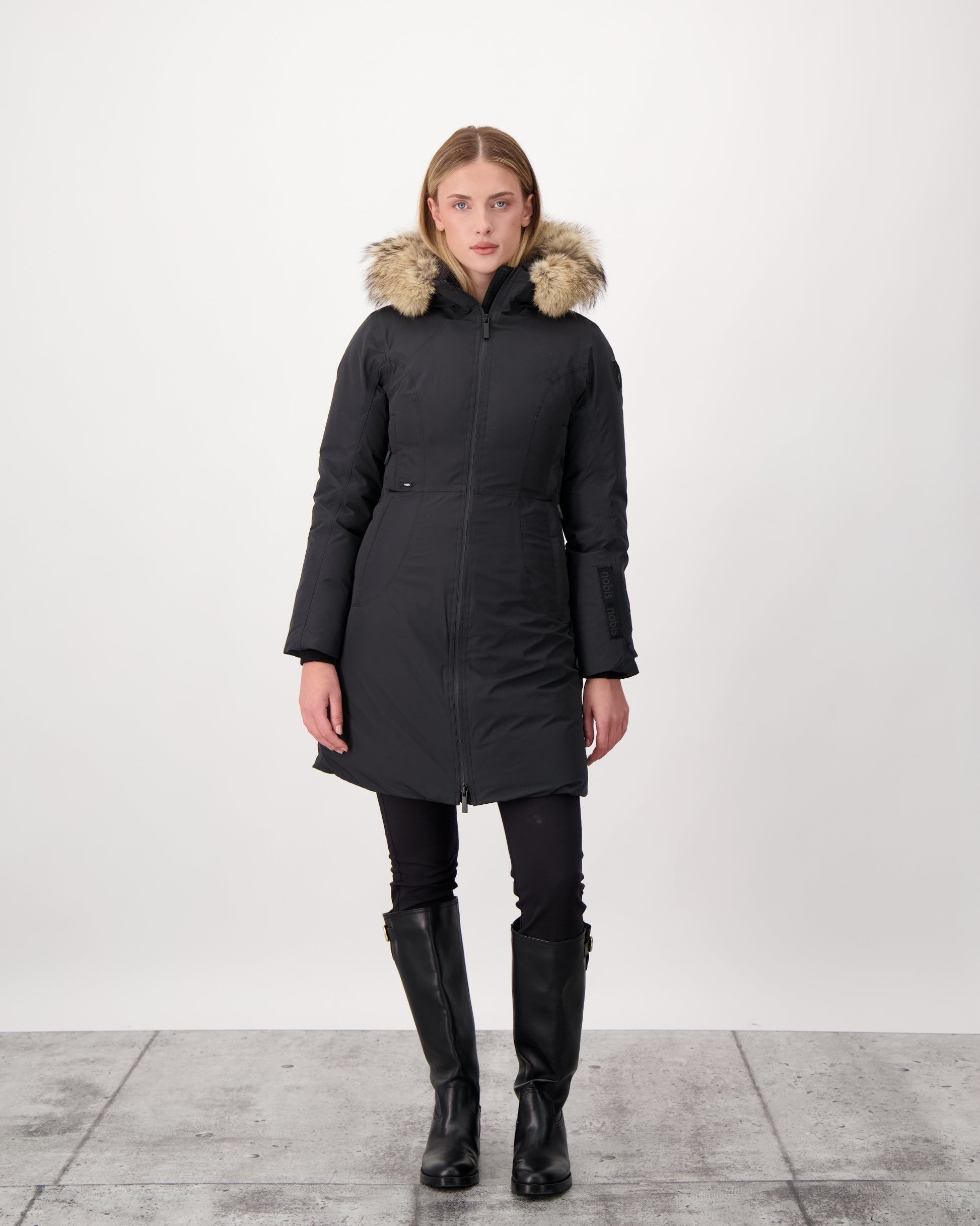 Ladies thigh length down-filled parka with non-removable hood and removable coyote fur trim in Black