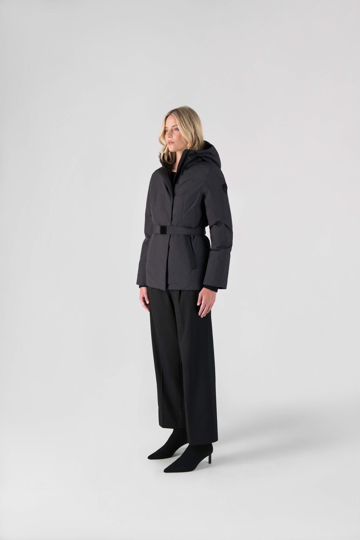 Ladies hip length down-filled parka with non-removable hood and adjustable belt in Black