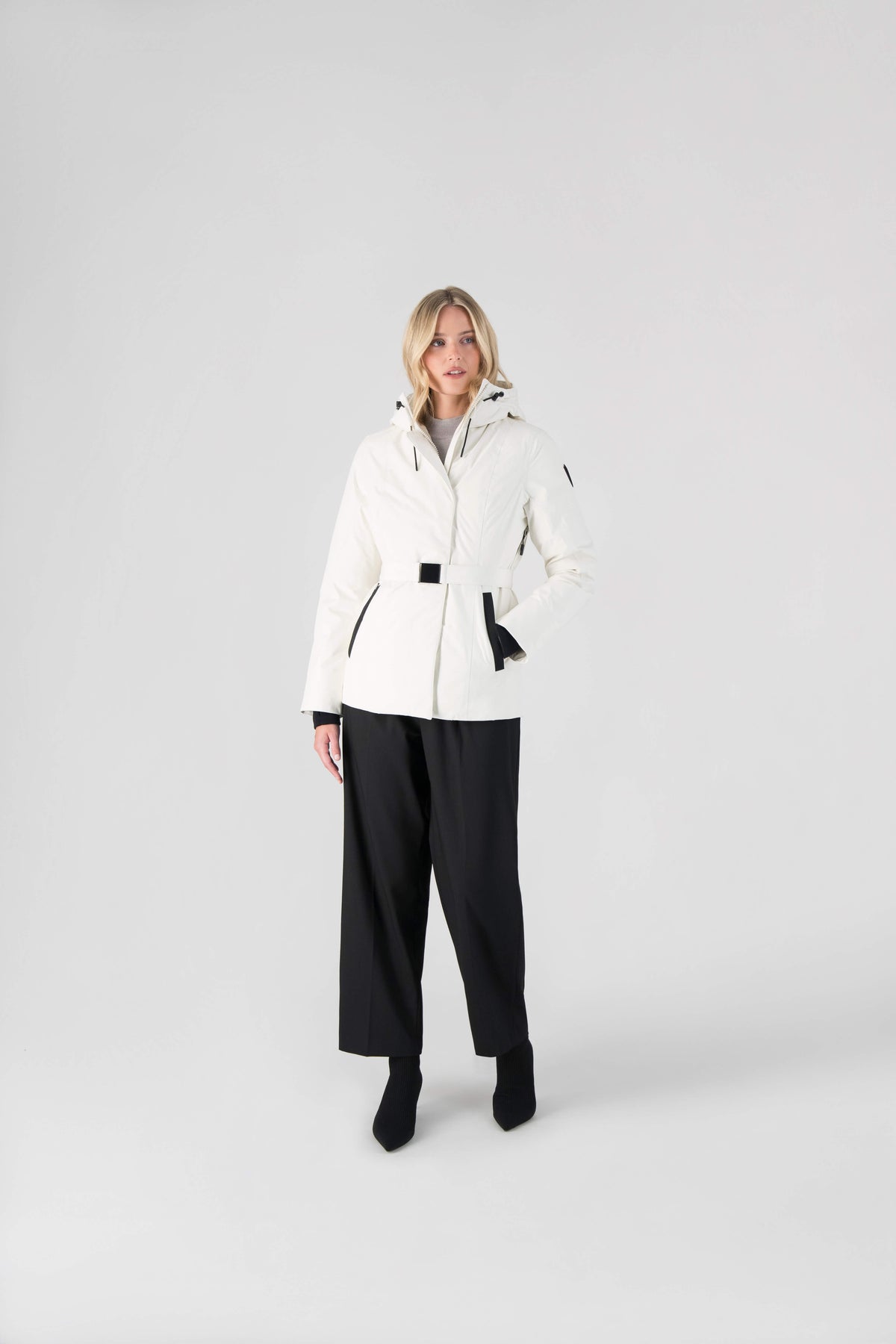 Ladies hip length down-filled parka with non-removable hood and adjustable belt in Chalk