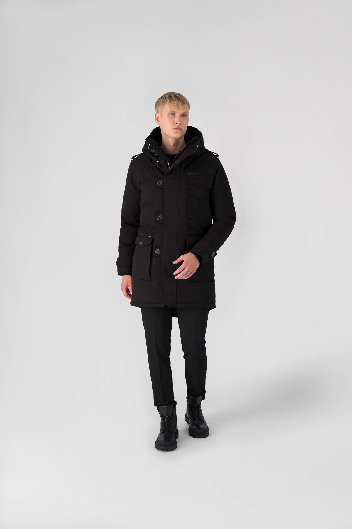 Men's down filled parka with faux button magnet closures and fur free hood with a fishtail hemline in Black