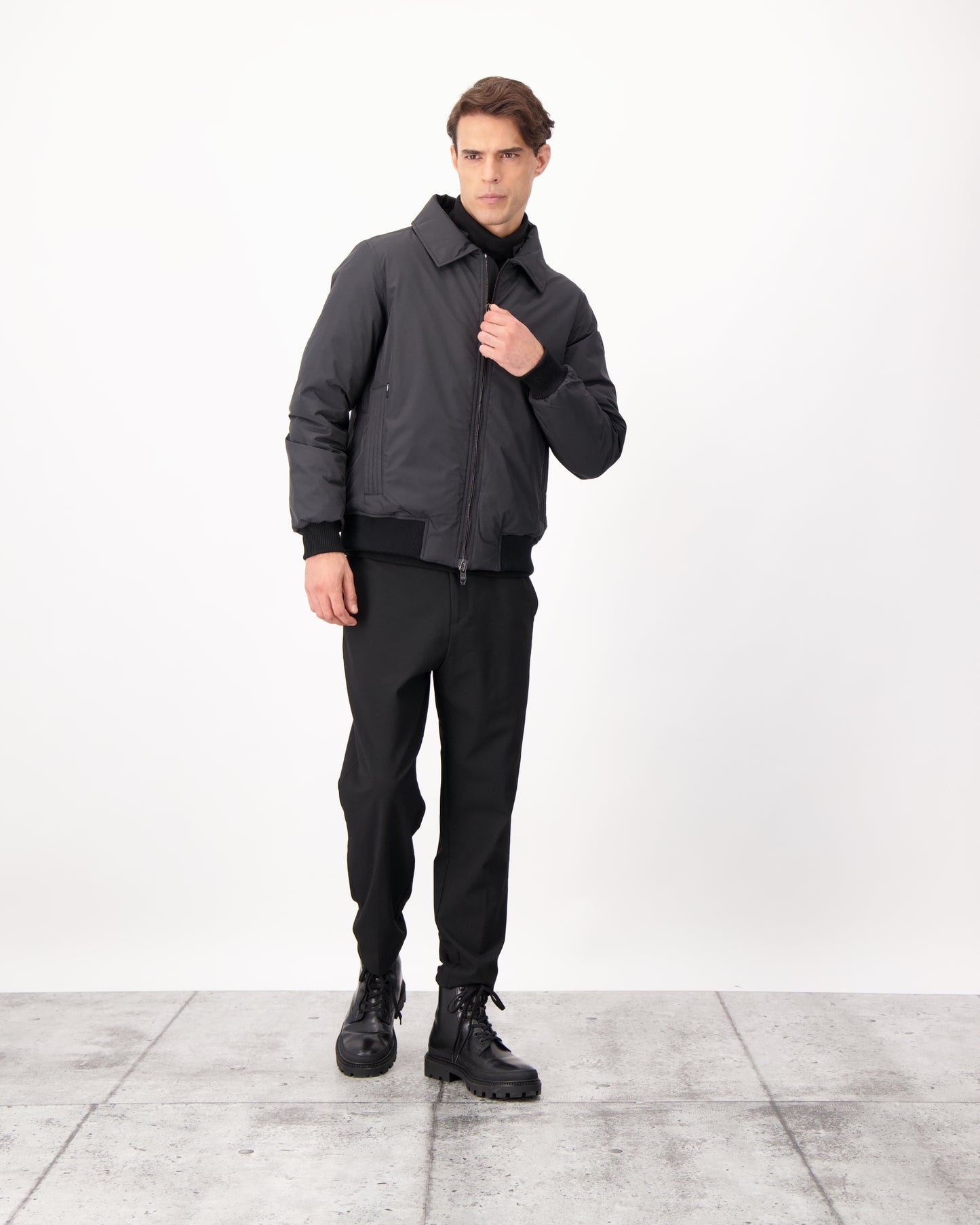 Sonar Men's Aviator Jacket in hip length, Canadian duck down insulation, removable shearling collar with hidden tuckable hood, and two-way front zipper, in Black