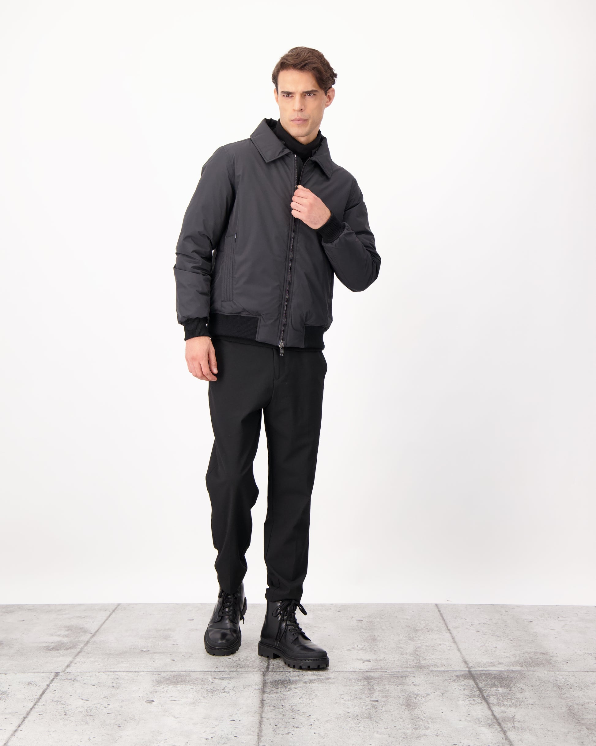 Sonar Men's Aviator Jacket in hip length, Canadian duck down insulation, removable shearling collar with hidden tuckable hood, and two-way front zipper, in Black
