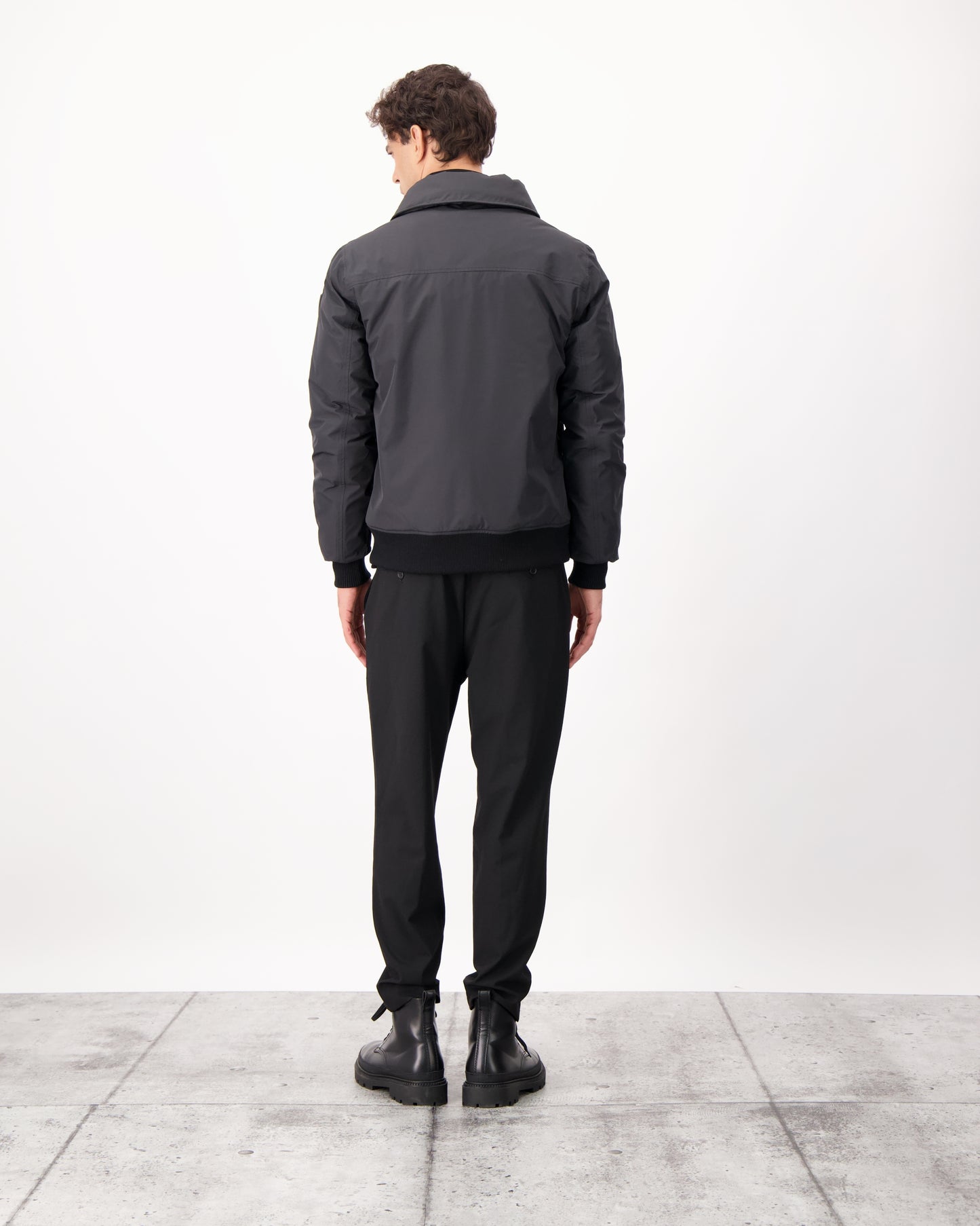 Sonar Men's Aviator Jacket in hip length, Canadian duck down insulation, removable shearling collar with hidden tuckable hood, and two-way front zipper, in Black