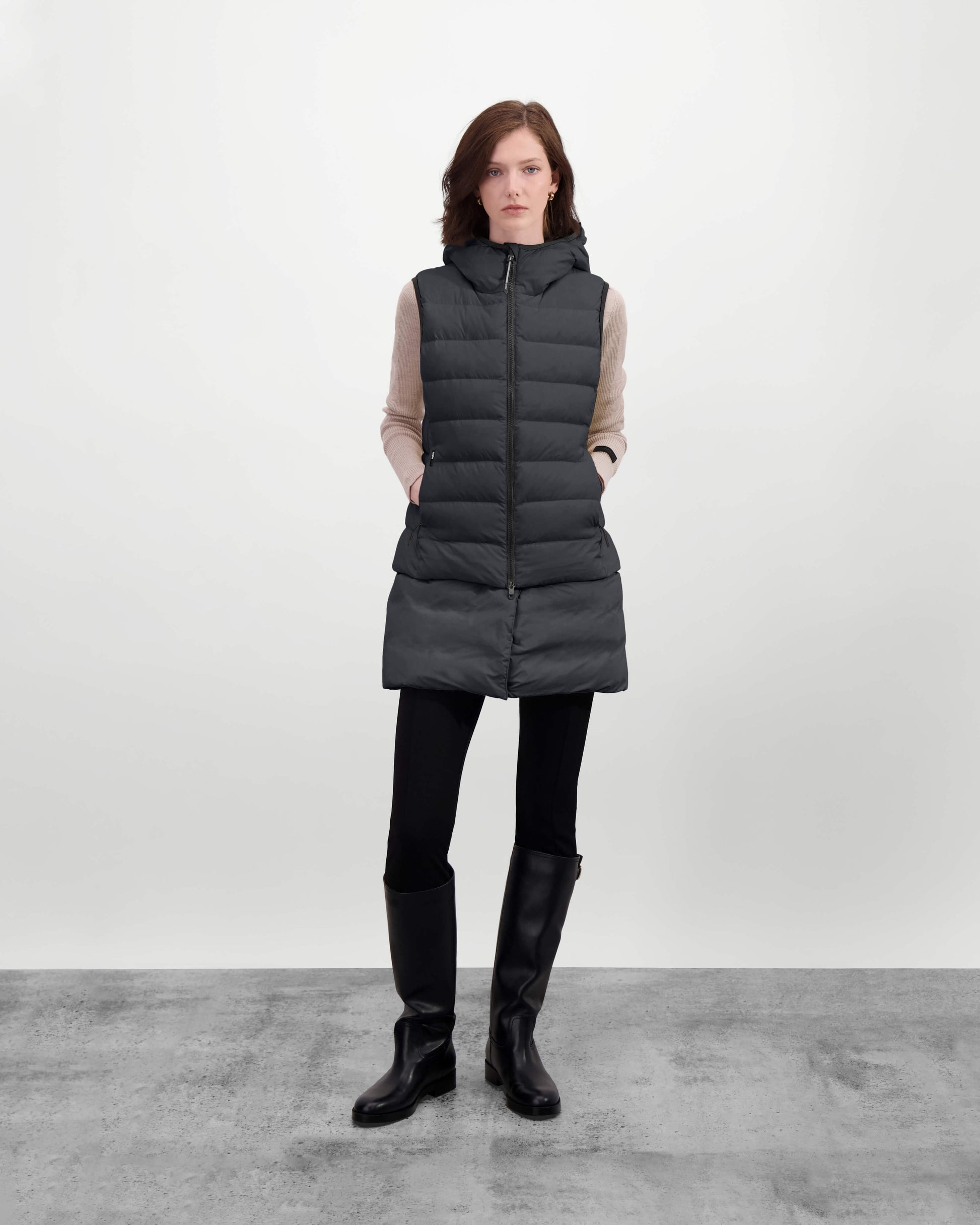 Saratoga puffer vest in Wheat insulated with Canadian white duck down, featuring stretch nylon ribbing for mobility, hidden waist drawcord, and a tailored fit for warmth and style. Lightweight and ideal for layering.