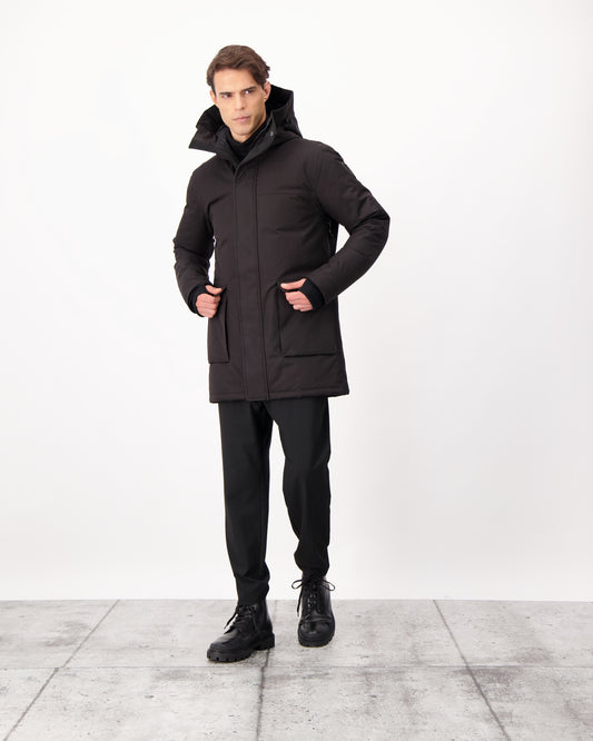 Yves Furless Men's Parka in thigh length, Canadian white duck down insulation, non-removable down-filled hood, flap pockets at waist, centre-front two-way zipper with magnetic wind flap, and elastic ribbed cuffs, in CH Black