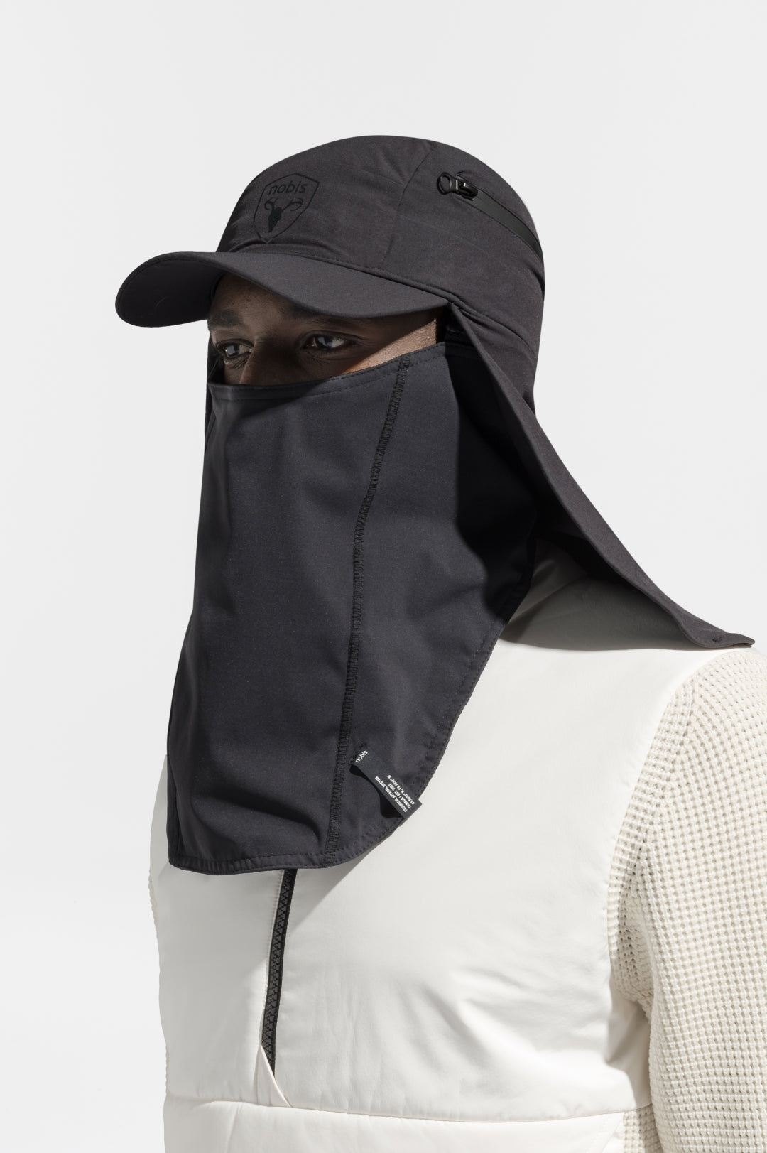 Tal Unisex 3-in-1 cap in 5-panel construction, curved peak brim, back flap, adjustable cobra buckle at back, zipper pocket on left side crown, and detachable face covering, in Black
