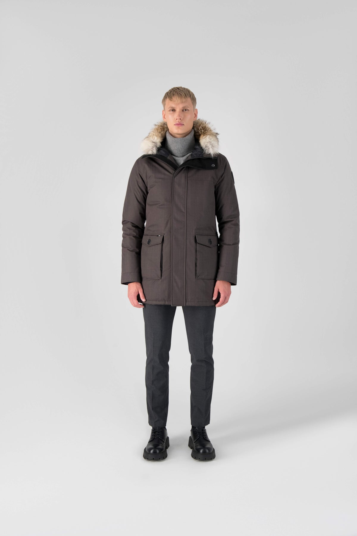 Men's slim fitting waist length parka with removable fur trim on the hood and two waist patch pockets in Steel Grey