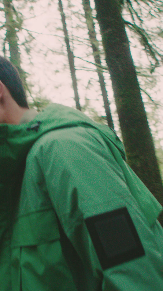 Wylder Men's Performance Rain Jacket in knee length, premium 3-ply Micro Denier and stretch ripstop fabrication, non-removable hood with reflective piping and adjustable draw cord, split utility chest pocket with magnetic flap closure, single welt pockets with magnetic closure at waist, back yoke with mesh ventilation, snap button wind flap, two-way branded zipper at centre front, telescopic sleeves with elasticized cuffs, interior draw cord at waist, in Comfrey