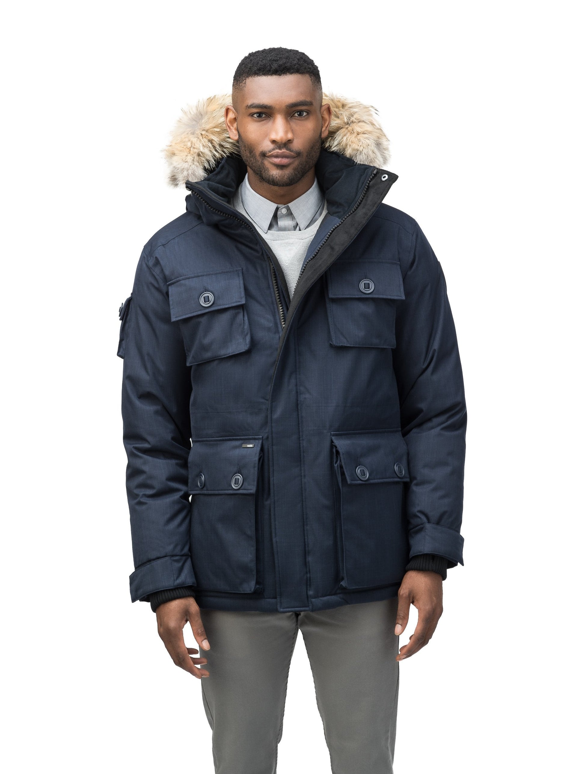 Men's down filled parka with four patch pockets and an adjustable waist with removable hood and removable fur trim in CH Navy