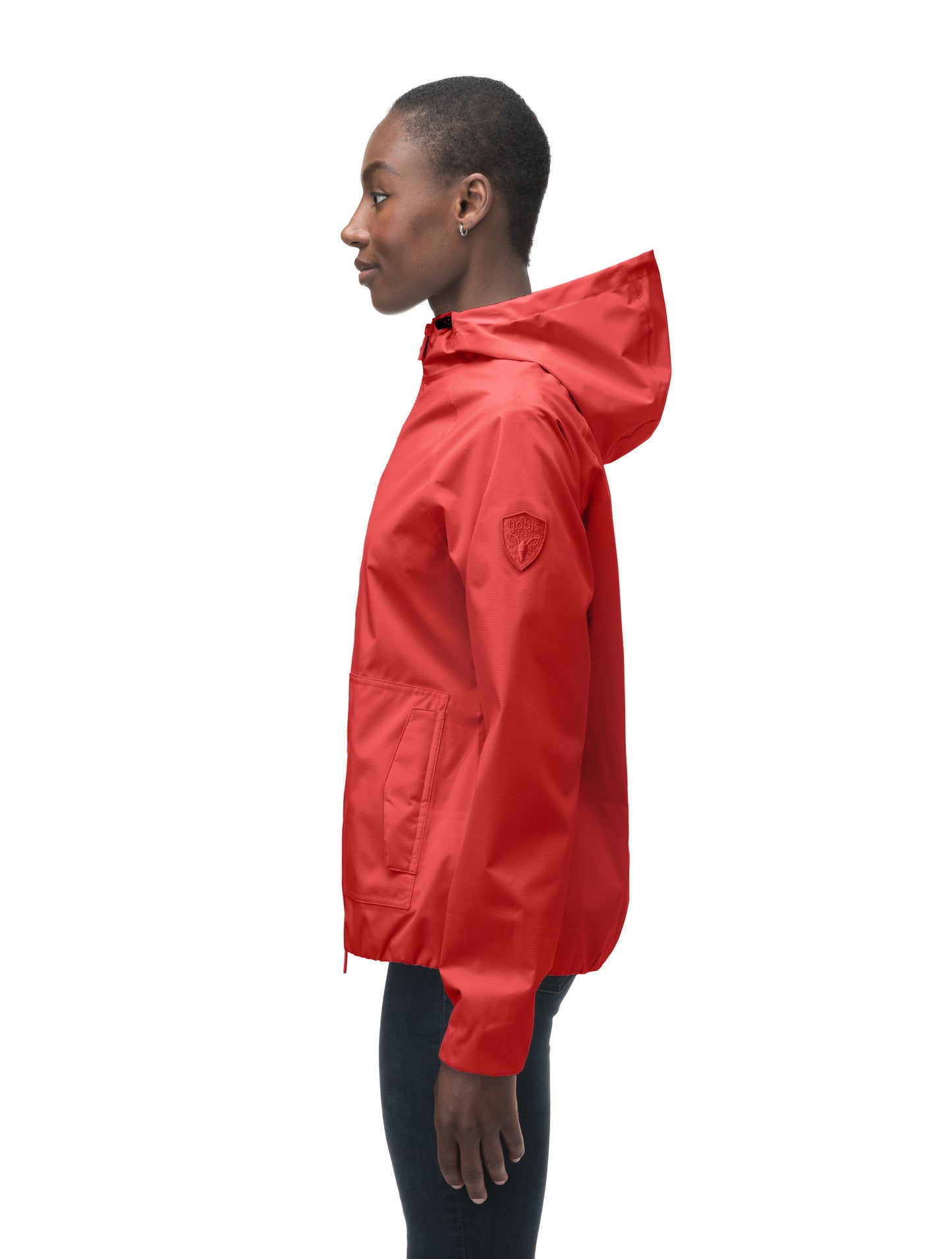 Women's hip length waterproof jacket with non-removable hood and two-way zipper in Vermillion