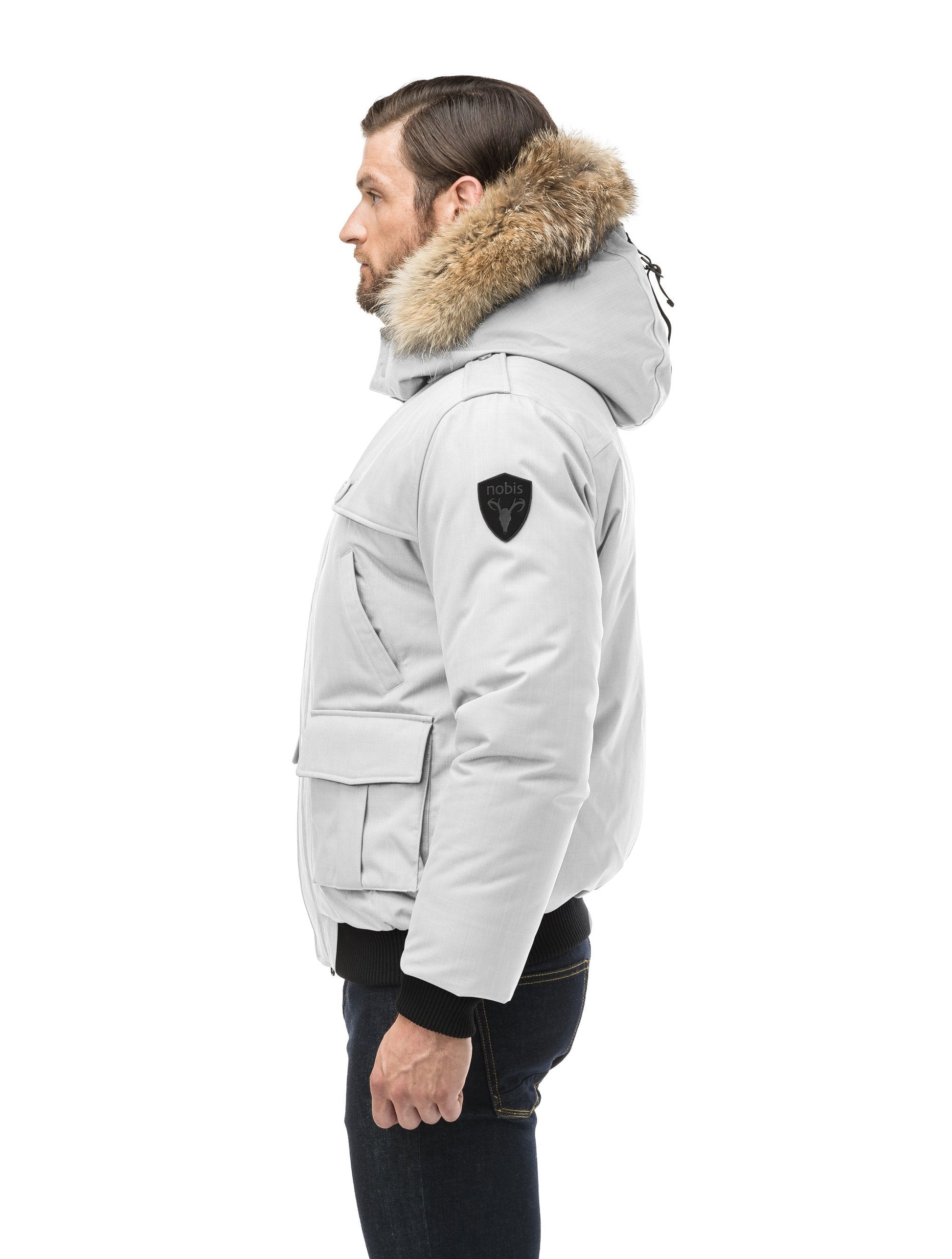 Men's down filled bomber that sits just above the hips with a completely removable hood that's windproof, waterproof, and breathable in CH Light Grey