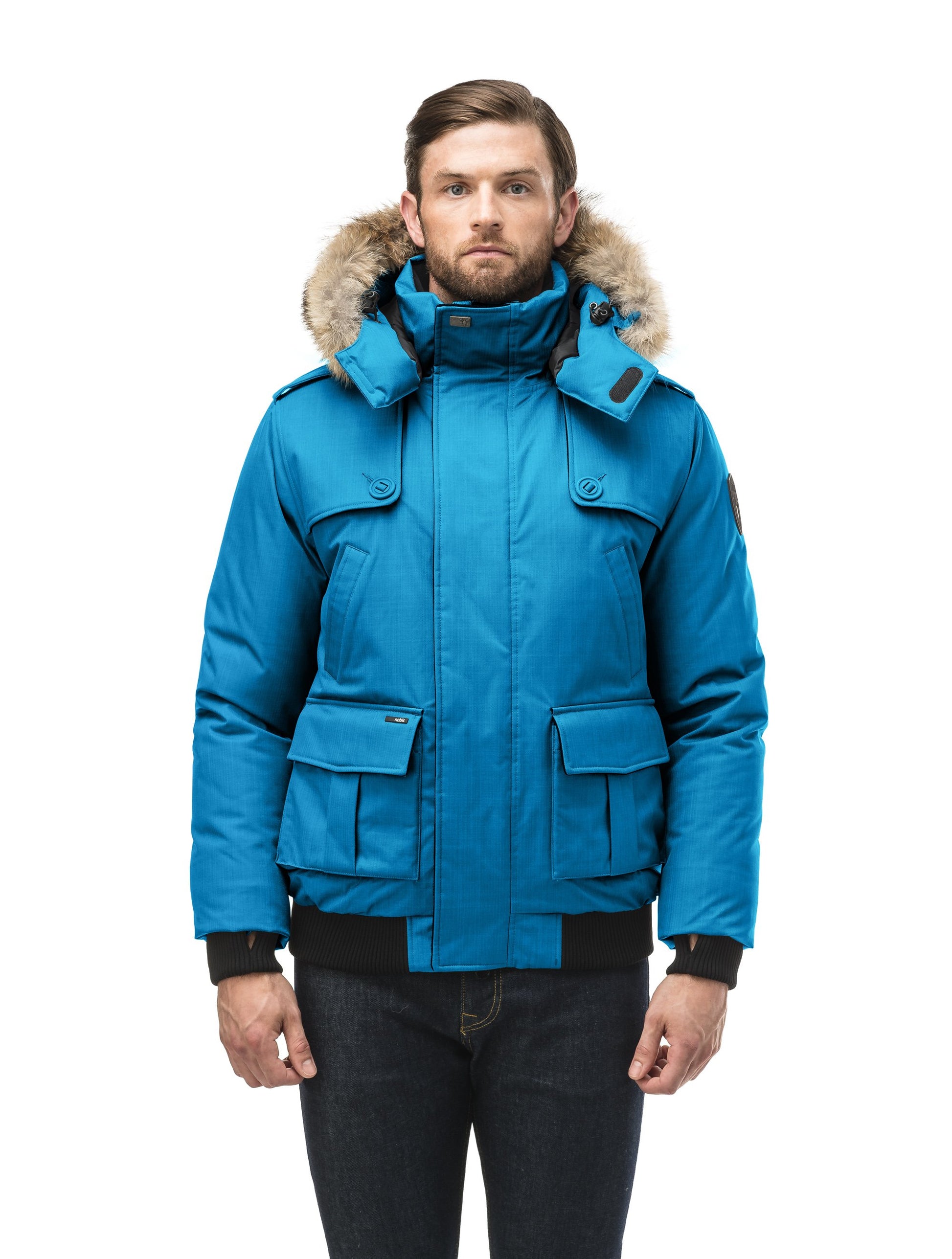 Men's down filled bomber that sits just above the hips with a completely removable hood that's windproof, waterproof, and breathable in Sea Blue